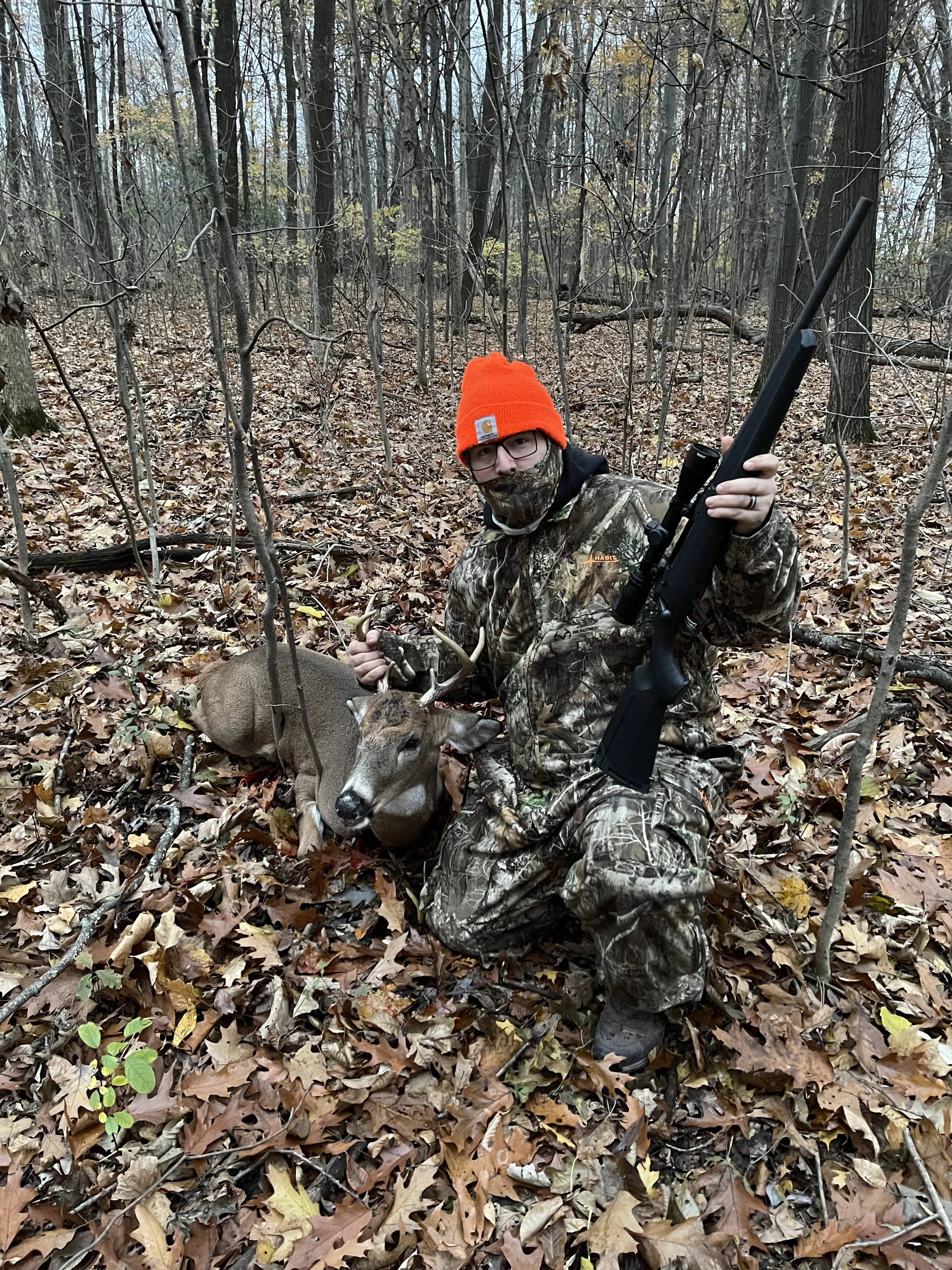 Tip of the Spear Outdoors guide with a Michigan public land whitetail buck.