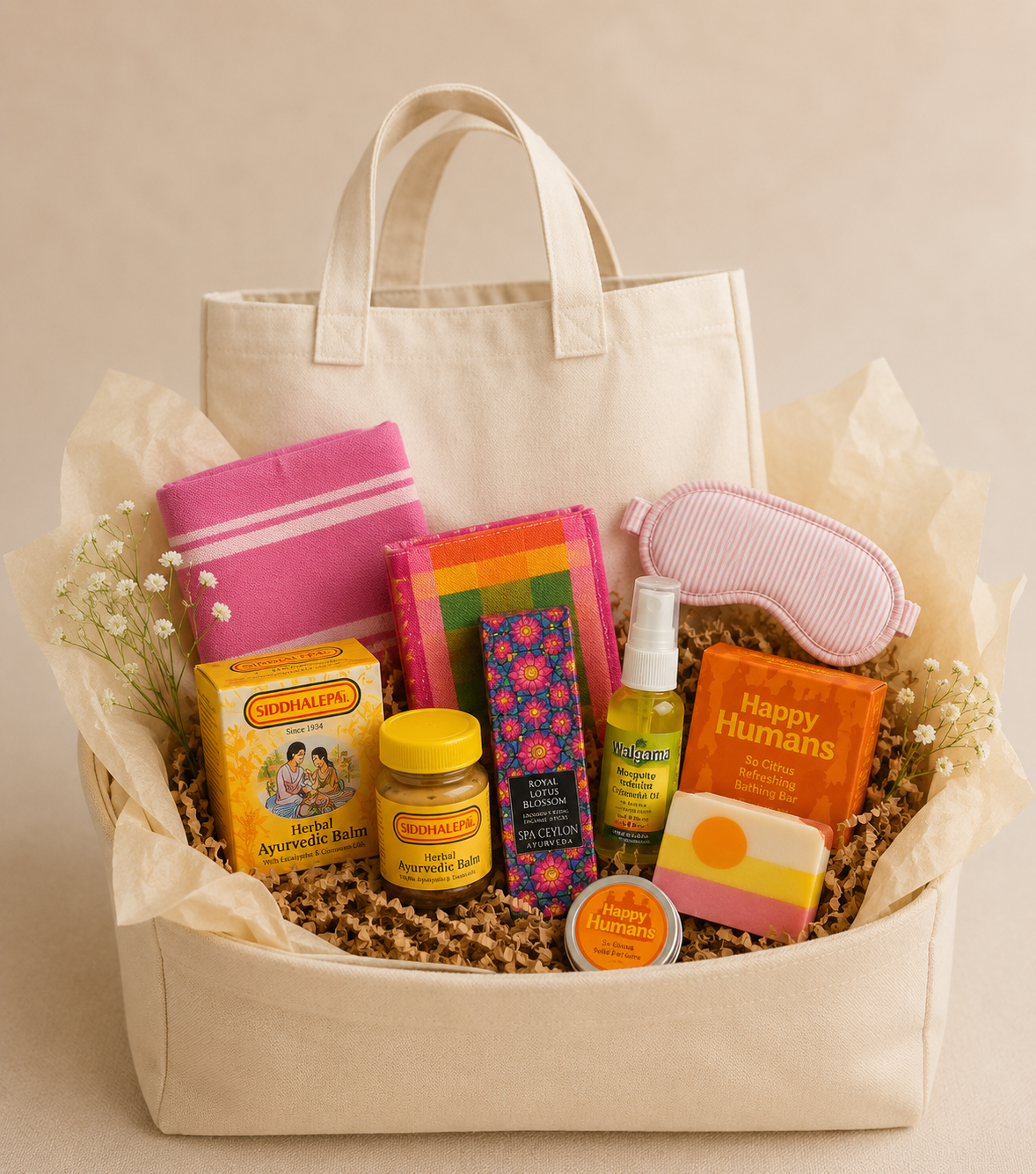 A gift bag filled with wellness and self-care items, including herbal balm, sleep mask, soap, mosquito repellent, and bath products, decorated with flowers.