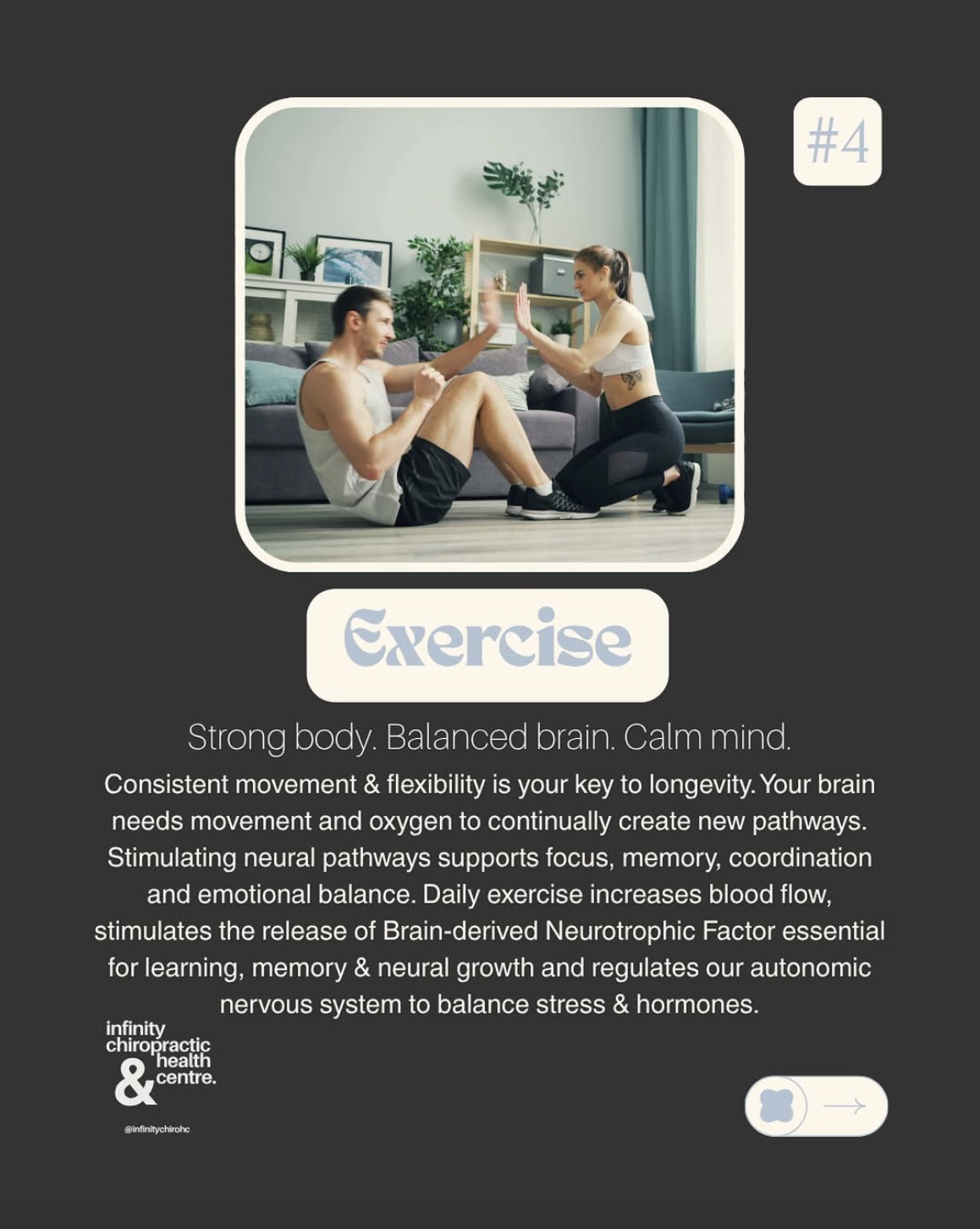 Man and woman exercising together on the floor in a living room, performing a seated workout with their hands pressed together in a high-five gesture.