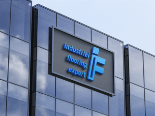 Exterior of a modern office building with reflective glass windows, displaying a sign that reads "industrial flooring expert" with a large letter "F".