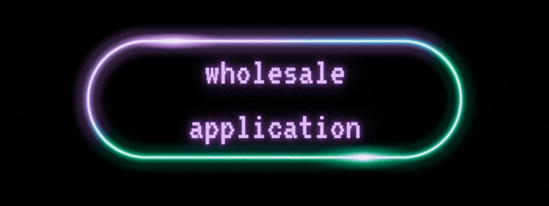 Neon sign displaying the words 'wholesale application' in purple text on a black background.