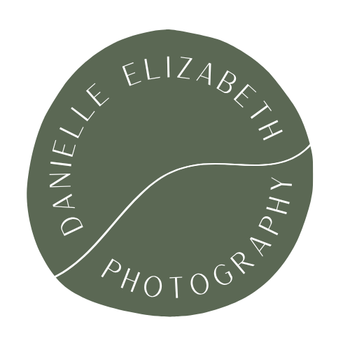 Logo for Danielle Elizabeth Photography with a green circle, white text, and a white curved line.