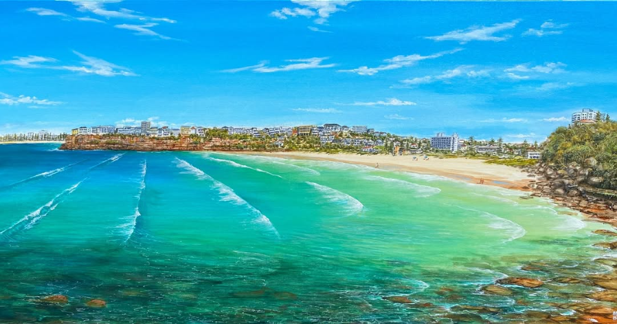 Painting of a beach with turquoise ocean waves, sandy shore, and buildings along the coastline under a blue sky with clouds.