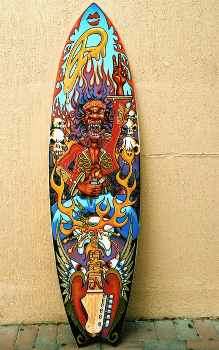 Colorful surfboard with a punk rock design, featuring a screaming figure with purple hair, flames, skulls, and abstract patterns.
