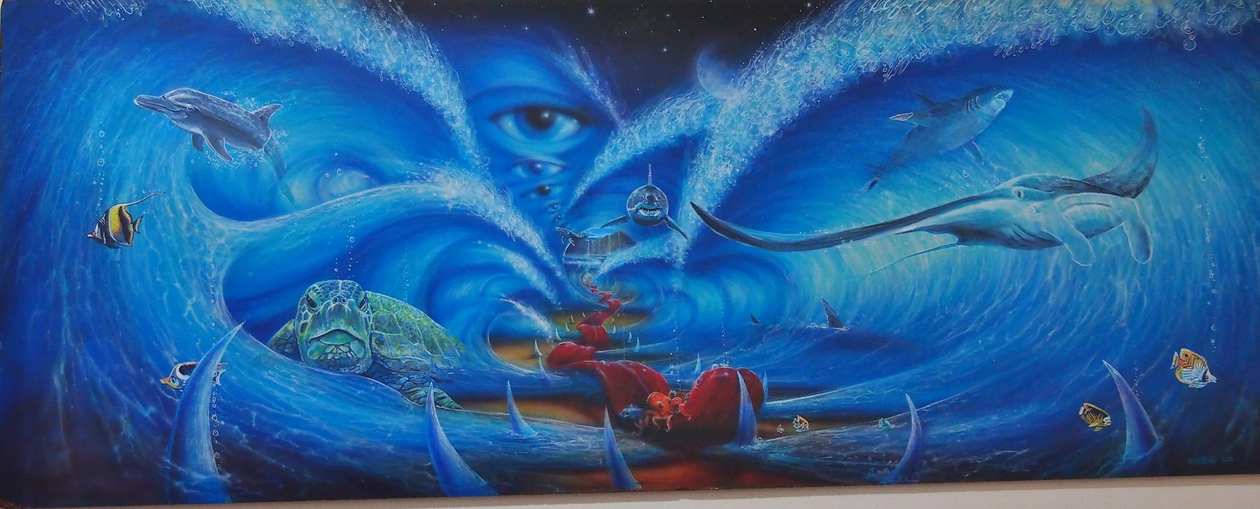 Surreal underwater scene featuring various sea creatures like sharks, dolphins, turtles, and colorful fish, with an abstract face with eyes peering out in the background.