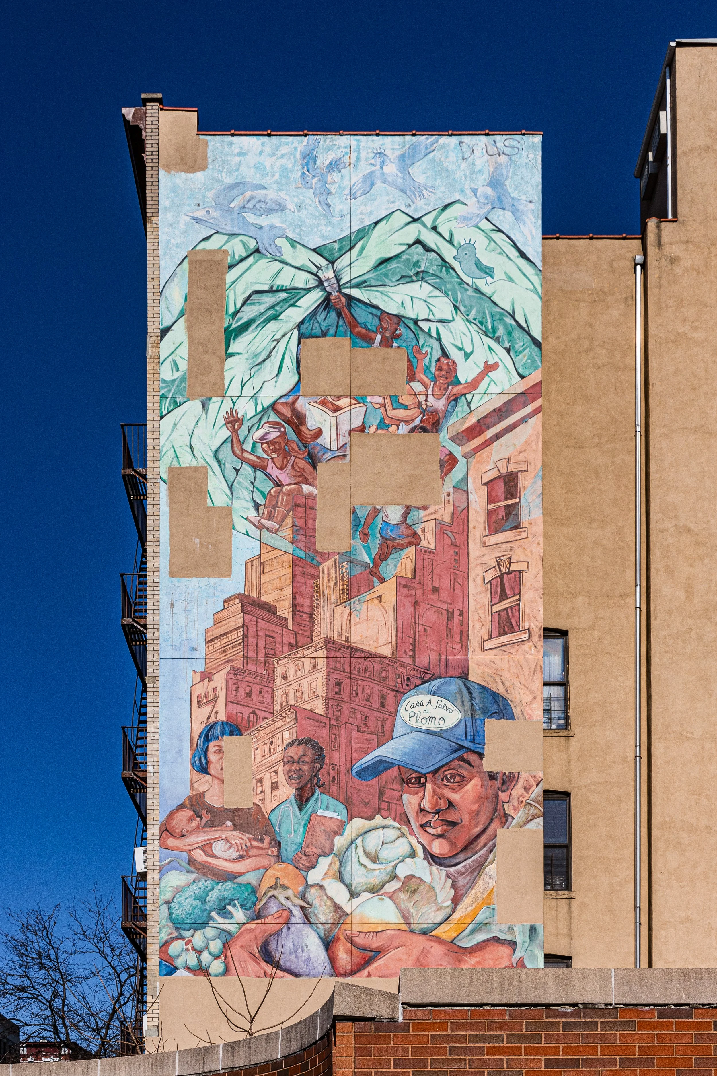 Large mural on building depicting people shopping for produce, with city buildings in the background and birds flying in the sky.