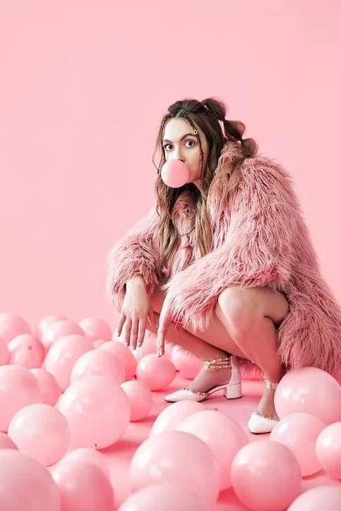 Young woman blowing a bubble symbolising early career growth
