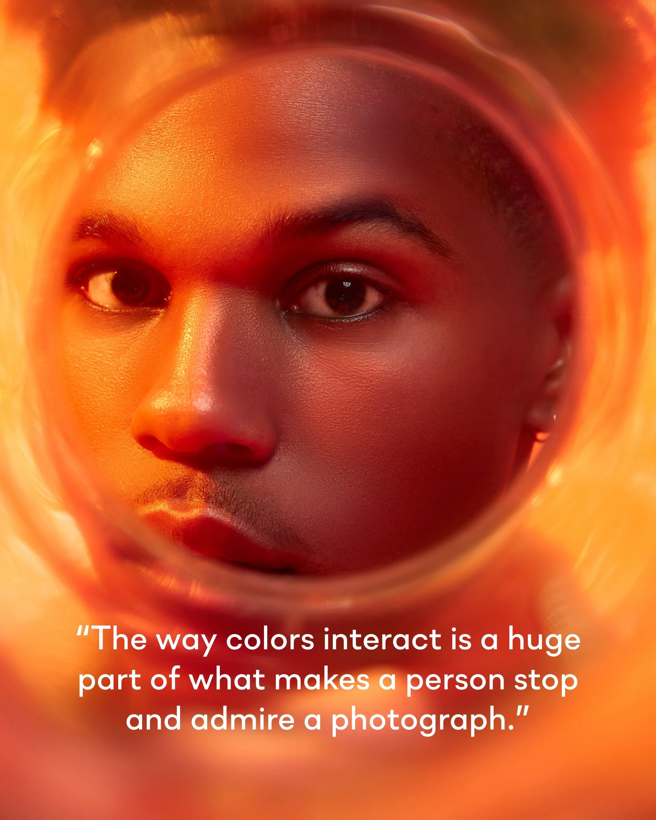 Close-up of a person's face, looking through a cylindrical object with orange and red hues, with a quote about colors and photography overlayed.