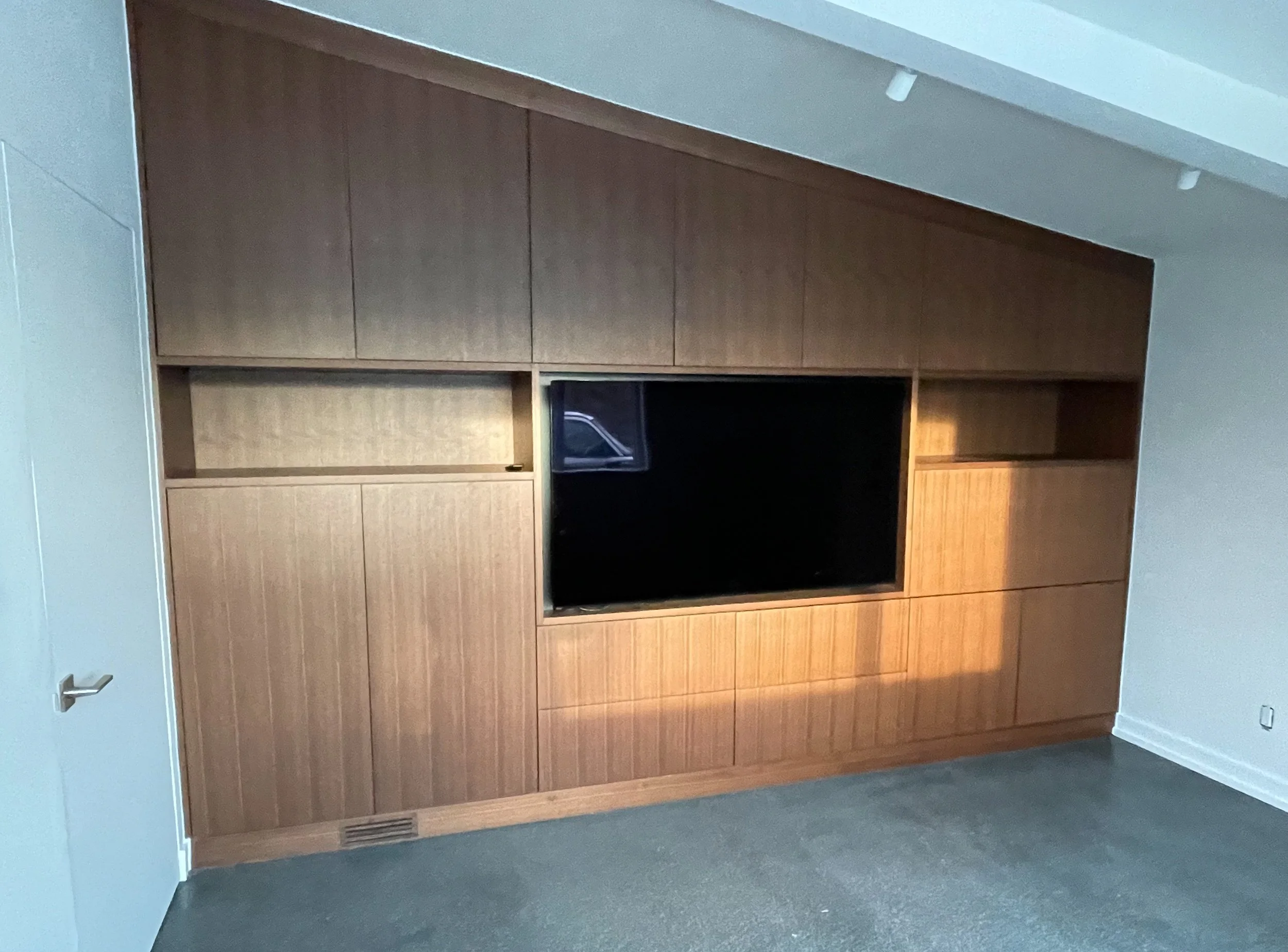 Wood veneer entertainment center with TV built-in 