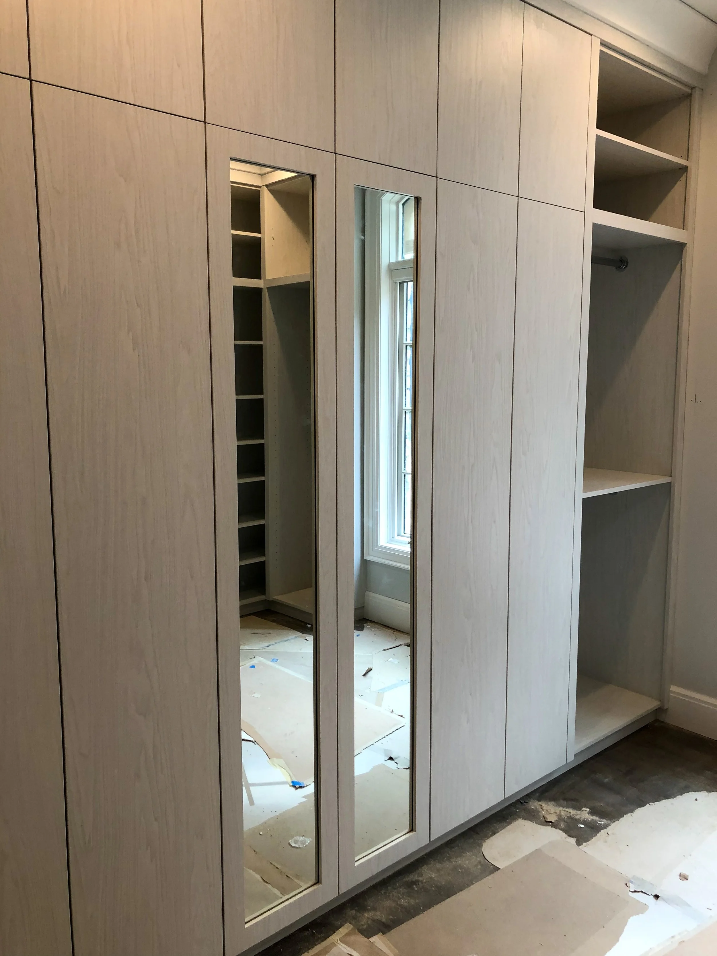 Modern closet with mirror doors 