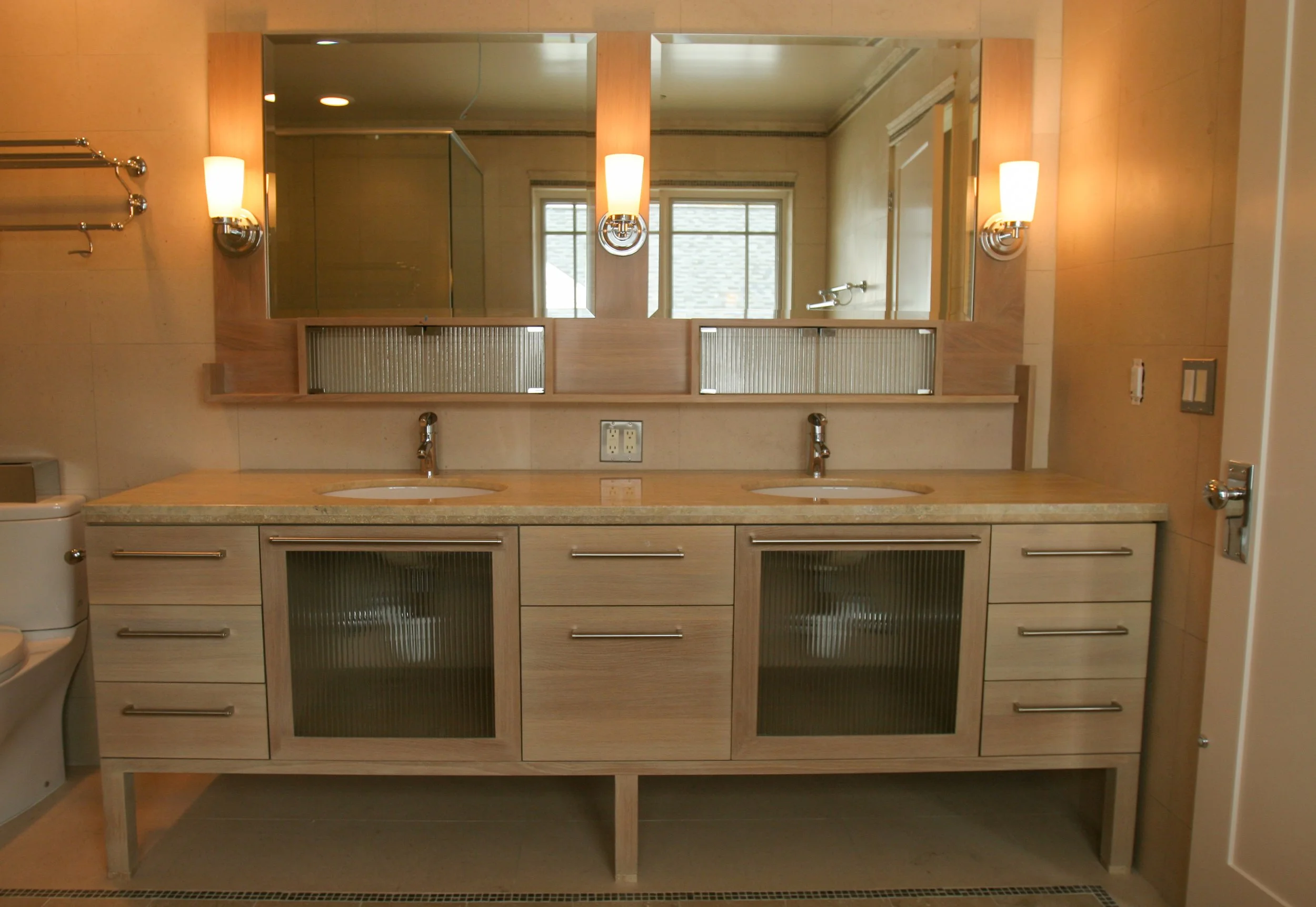 Maple double vanity with reeded glass center panels