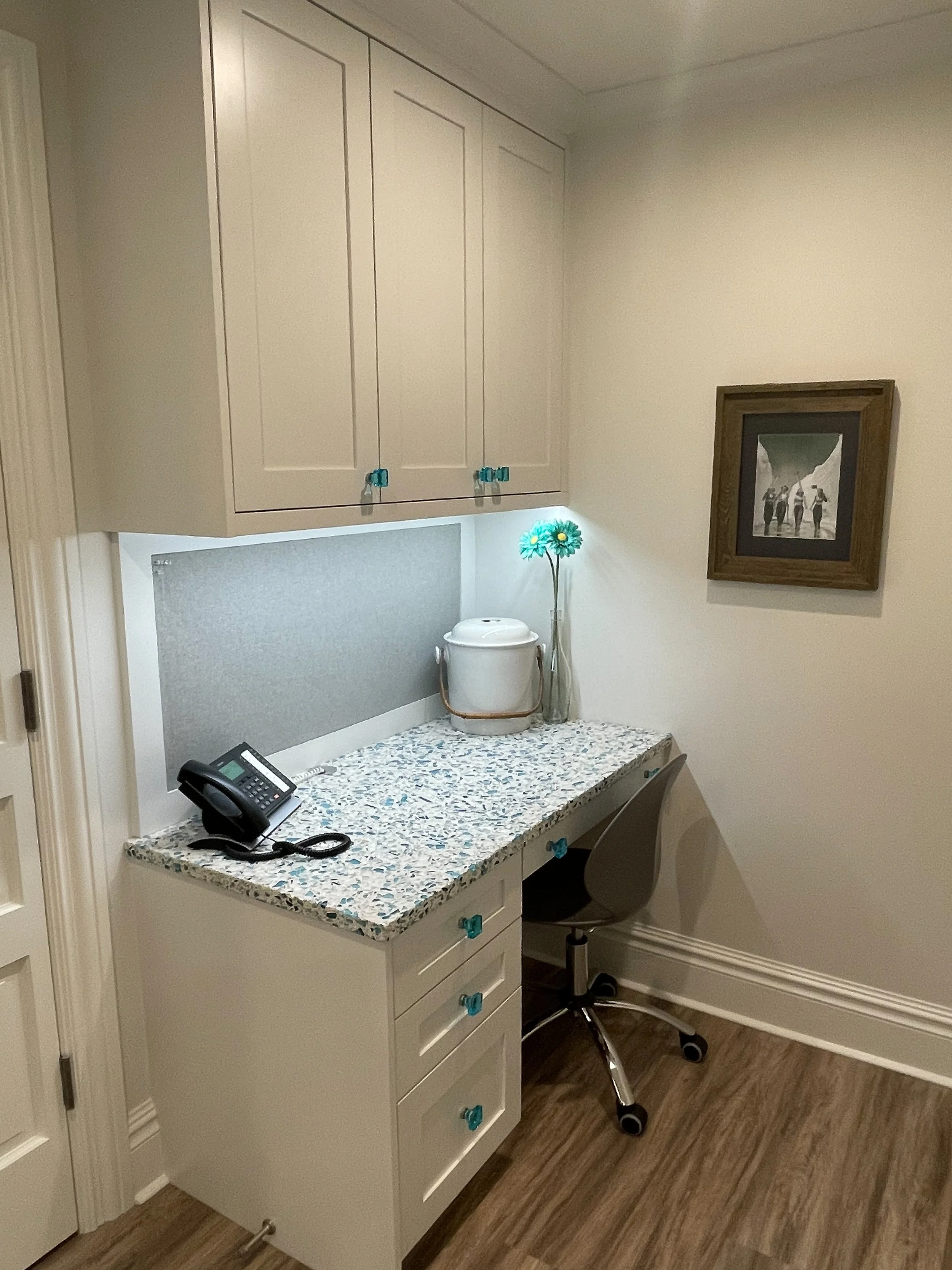 White command center with blue backsplash and hardware 