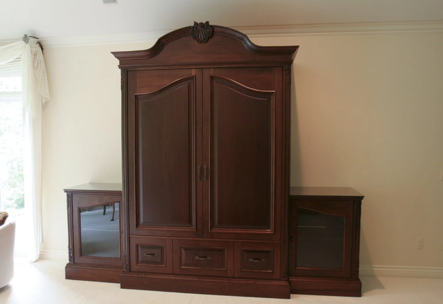Dark wood armoire with arch top 