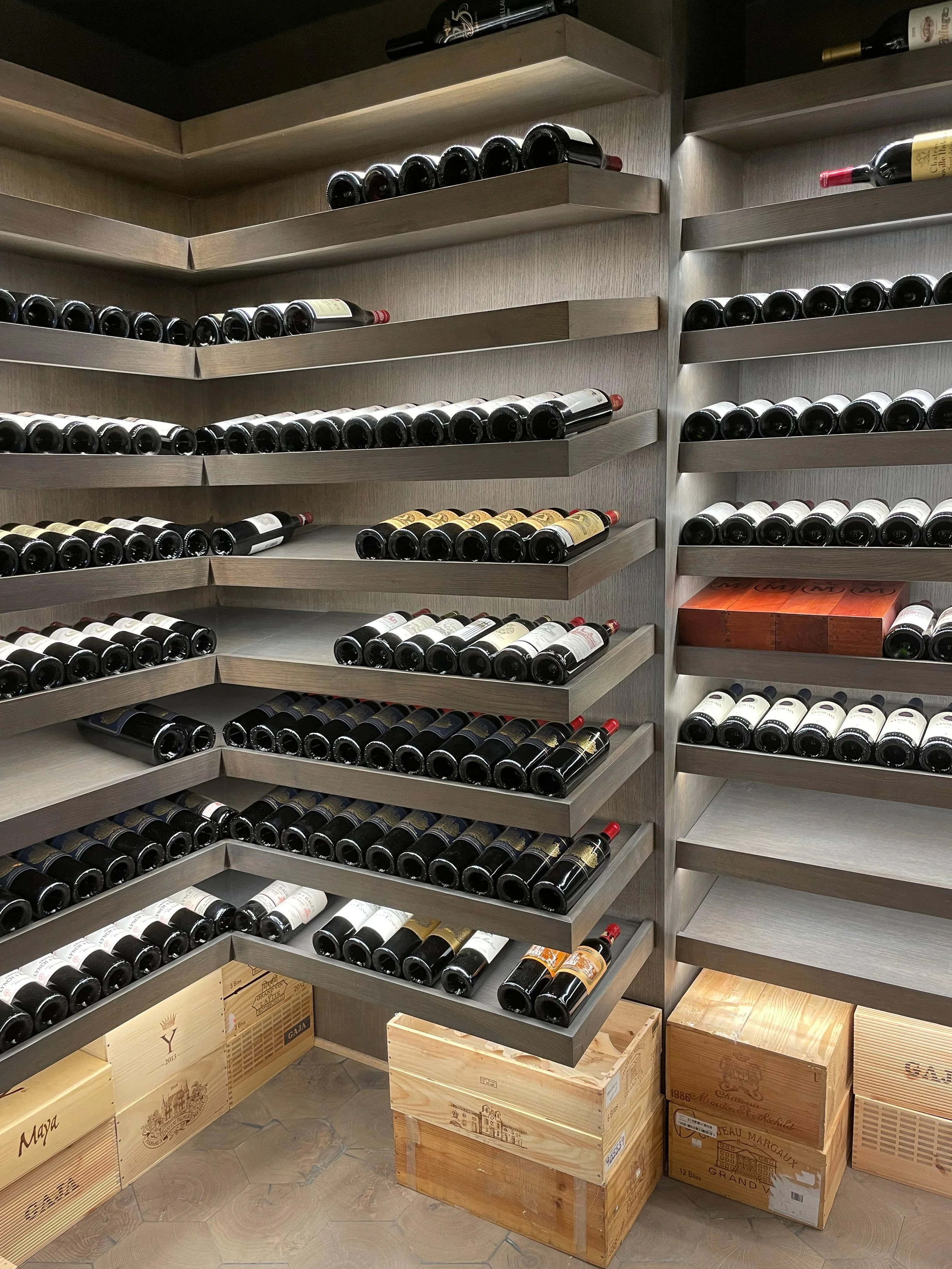 Modern grey wine cellar with integrated LED lighting