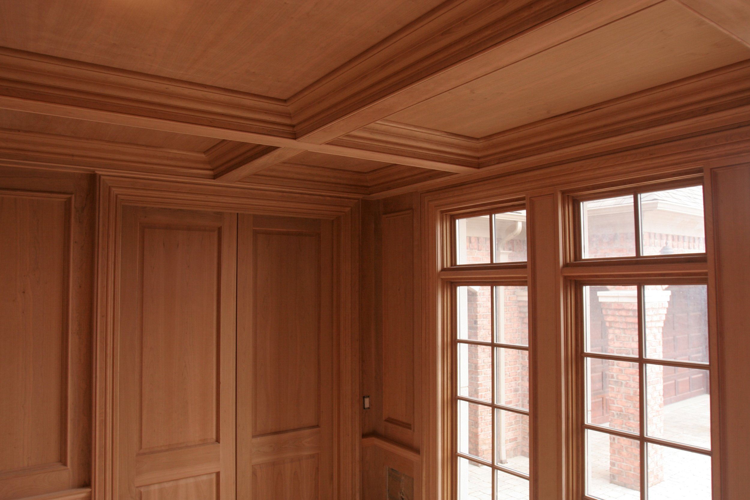 Custom wood paneled room and coffered ceiling