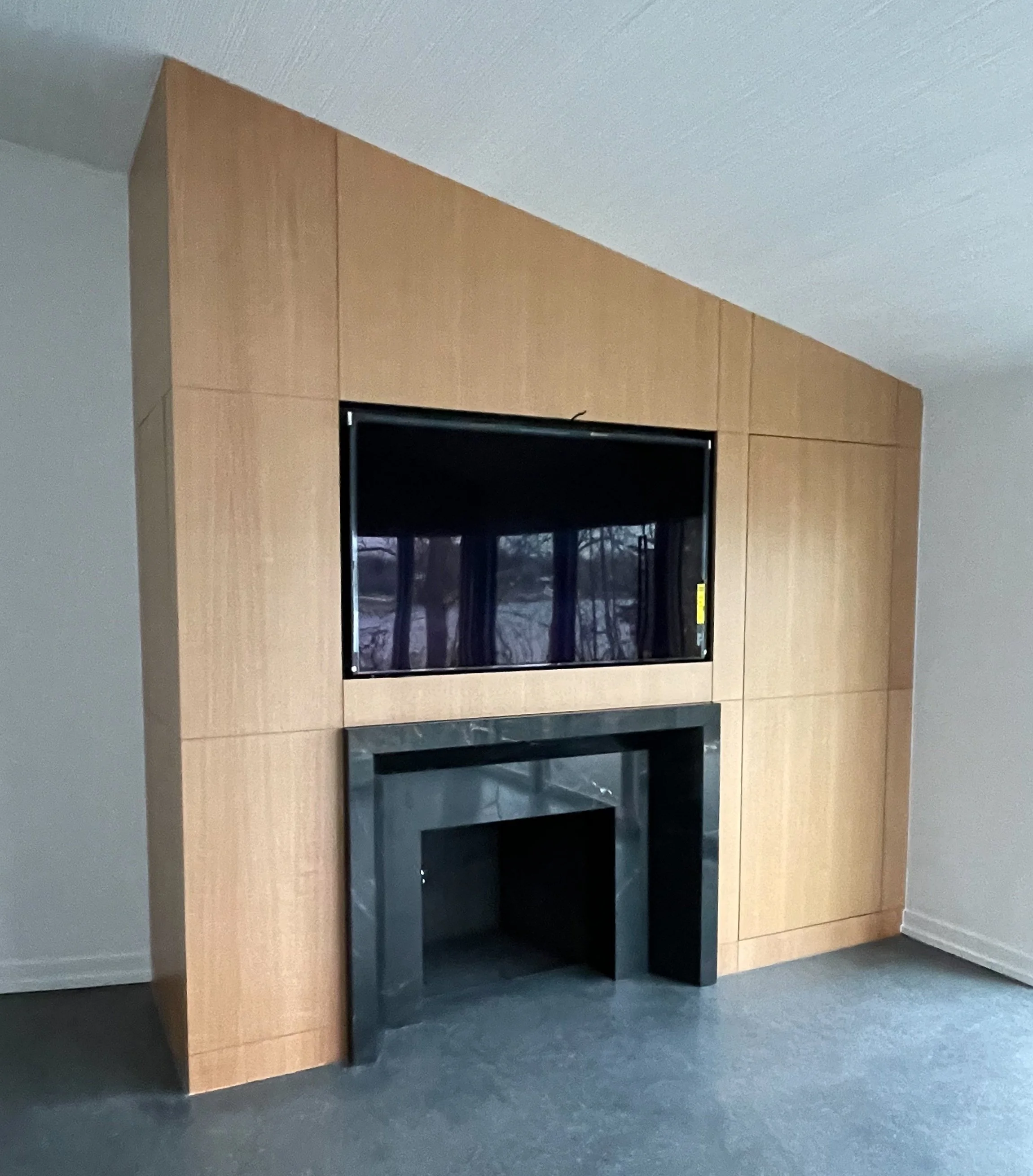 Custom wood veneer fireplace wall 