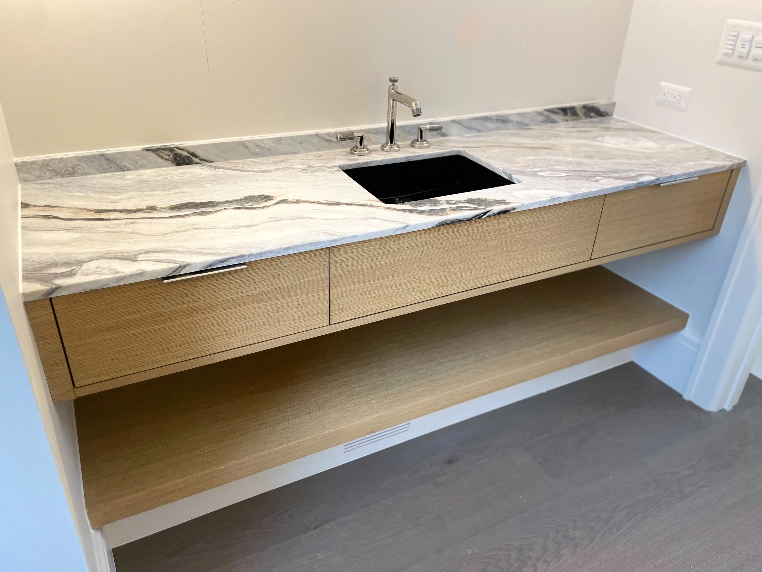 White oak vanity with open shelf below 