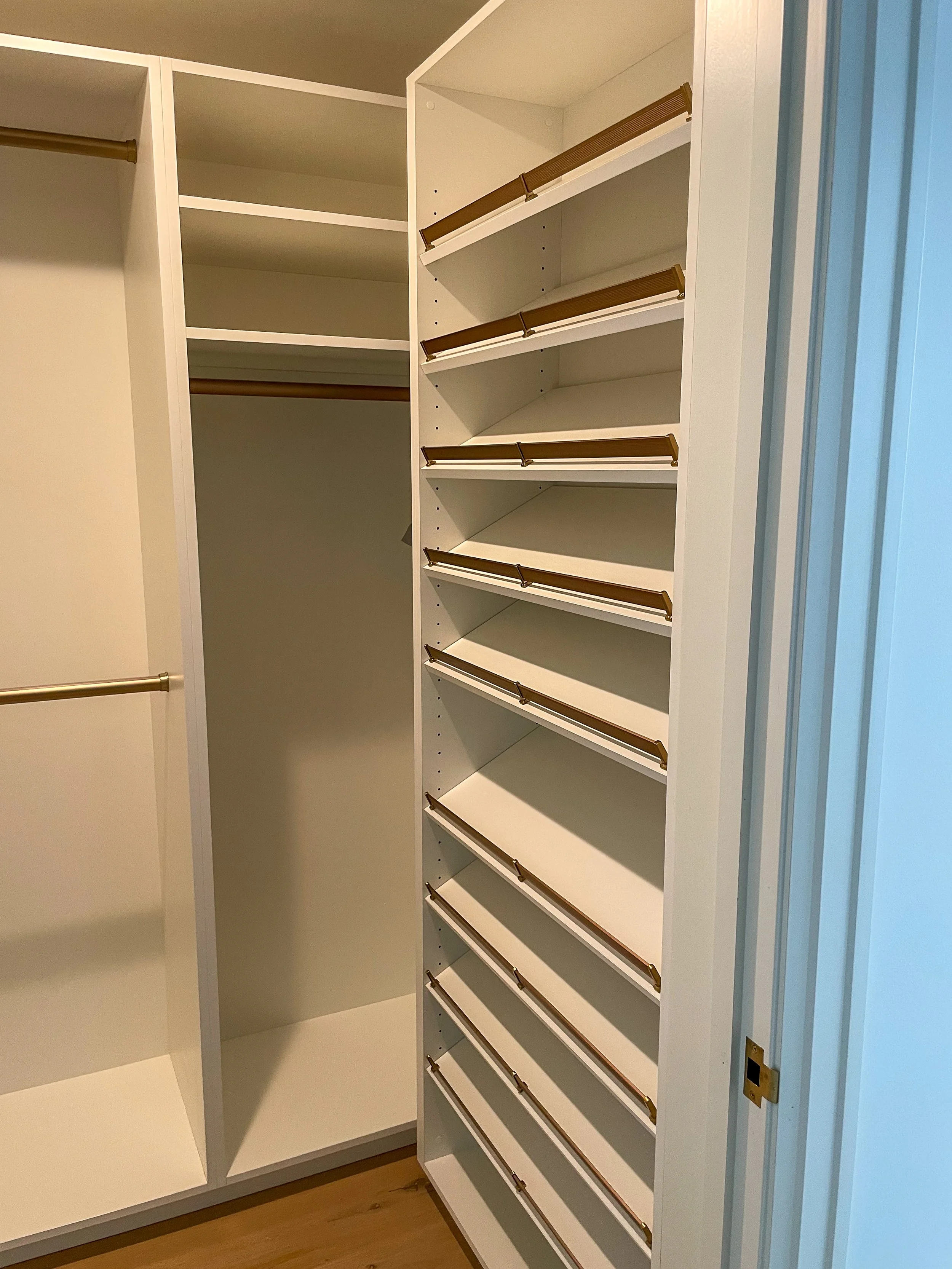 Simple closet system with brass hardware 