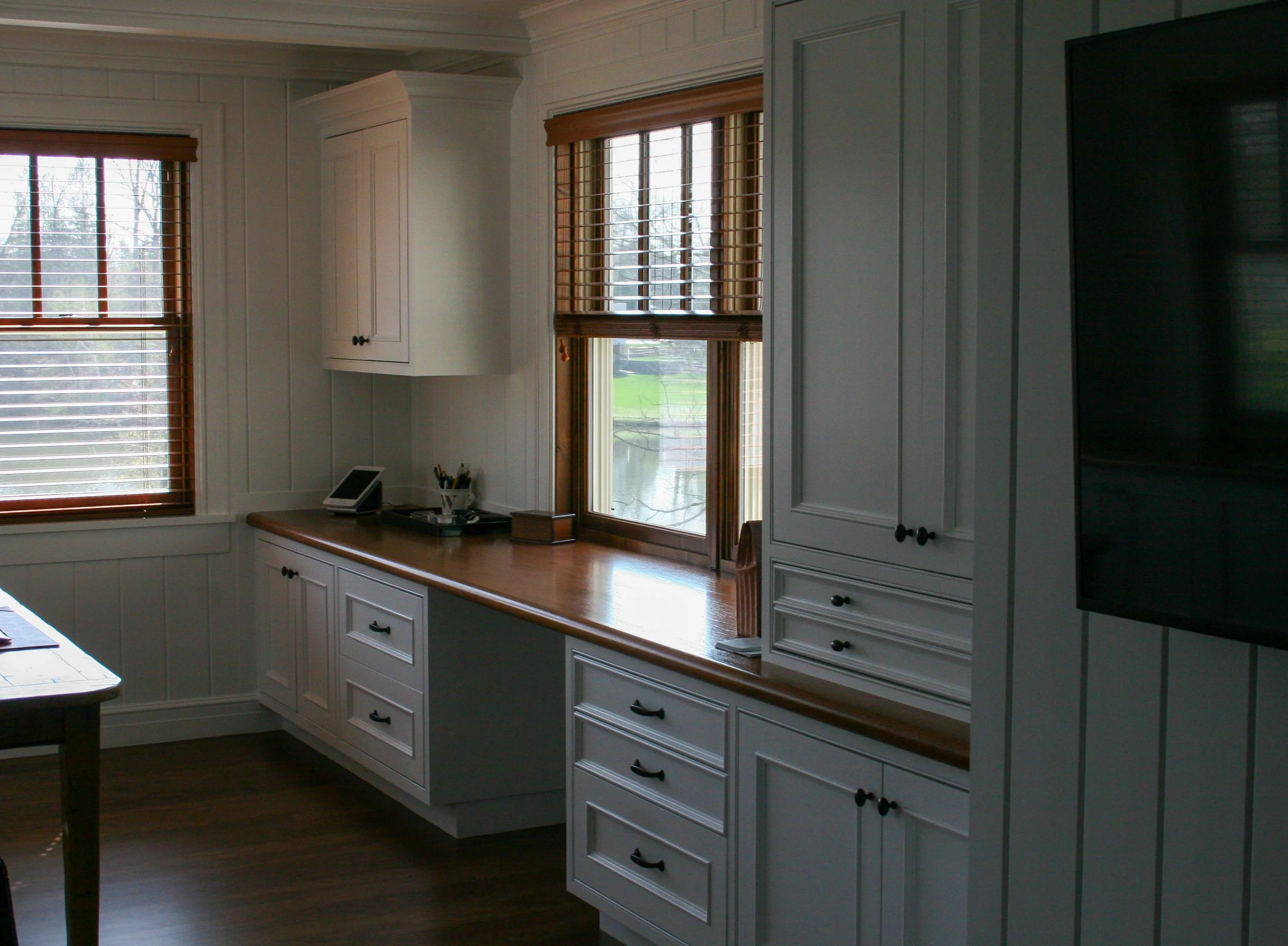 White home office with wood tops