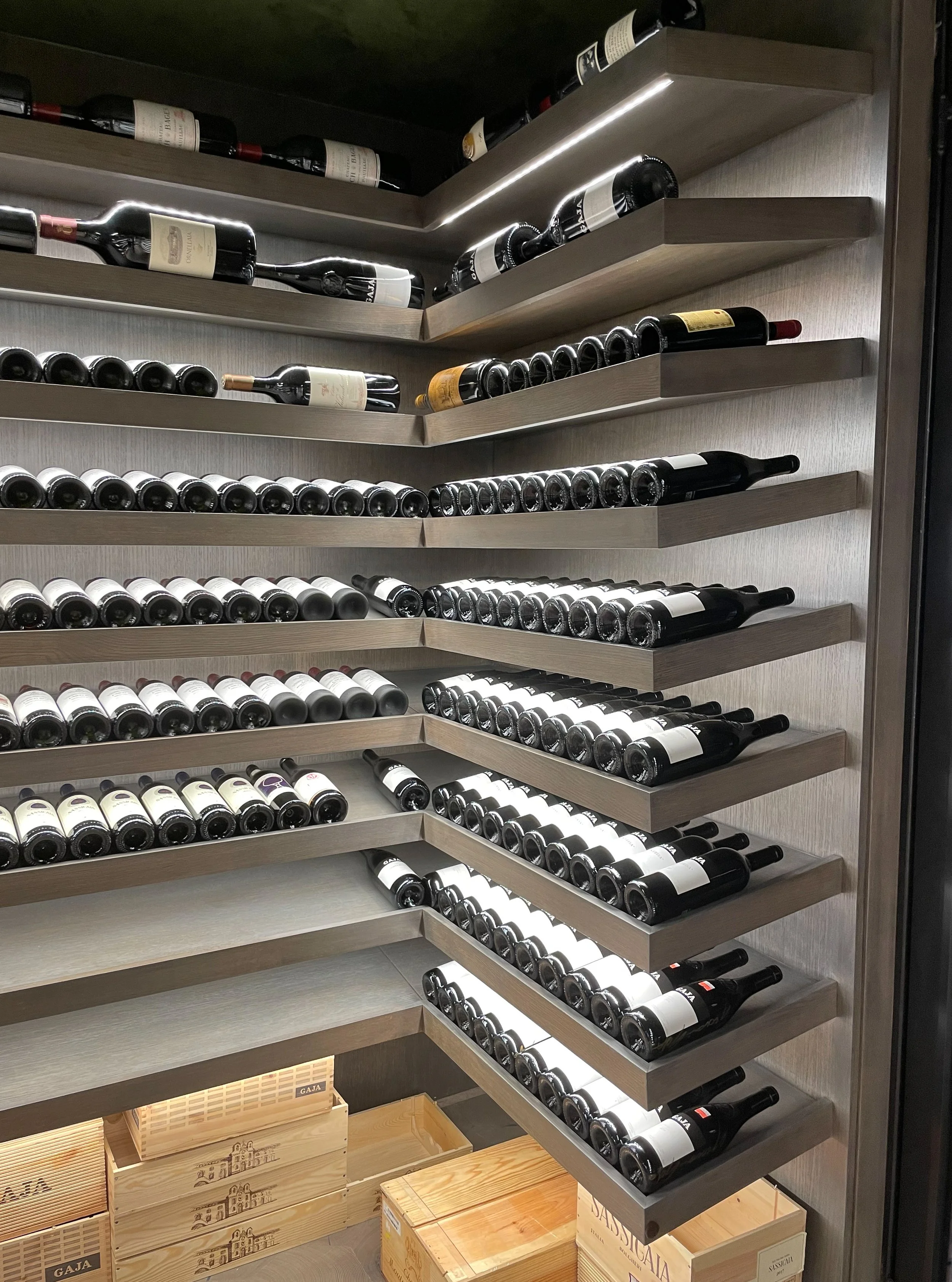Modern grey wine cellar with integrated LED lighting