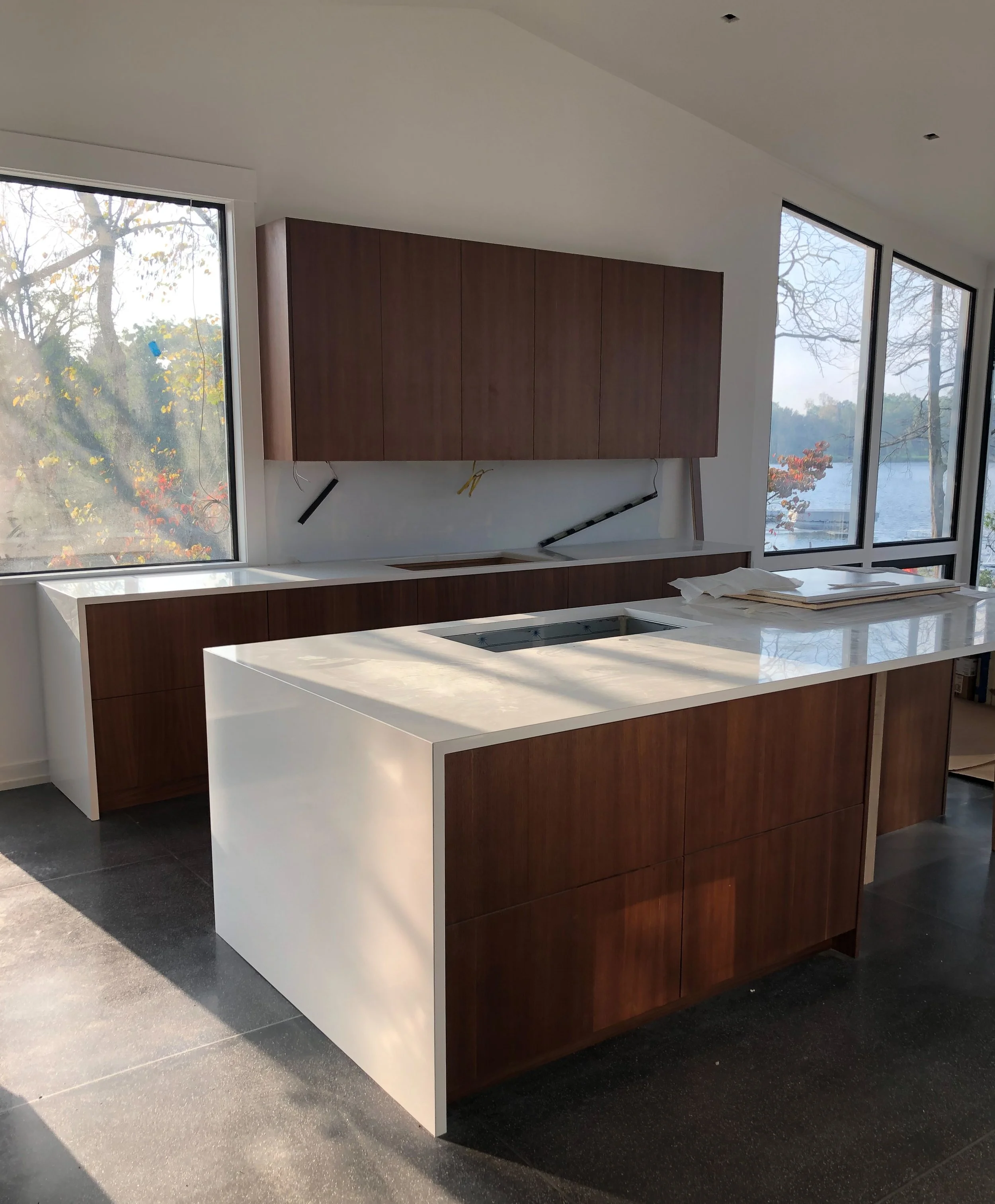 Modern kitchen with white quartz waterfall ends 