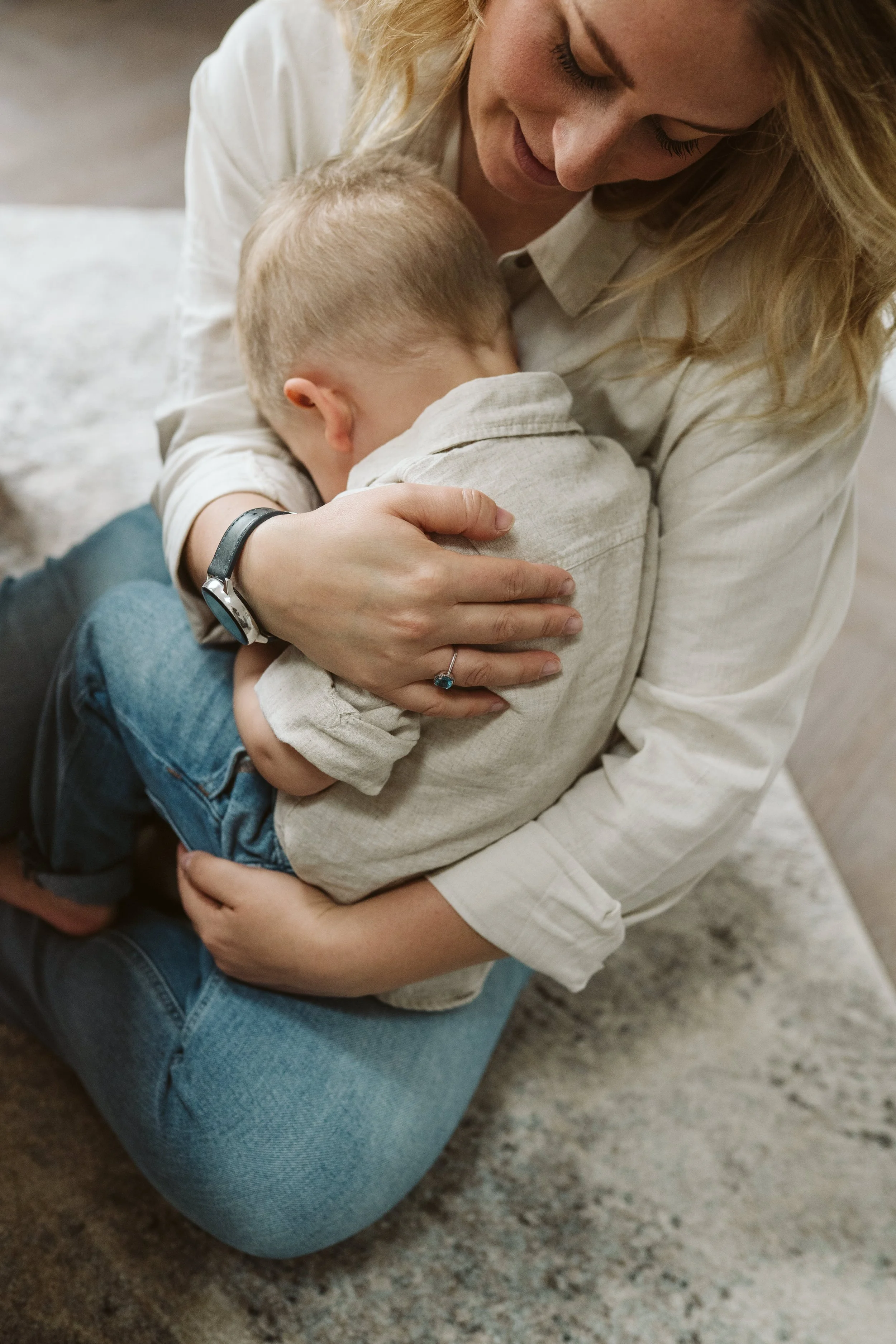Close-up of mum cuddling her child