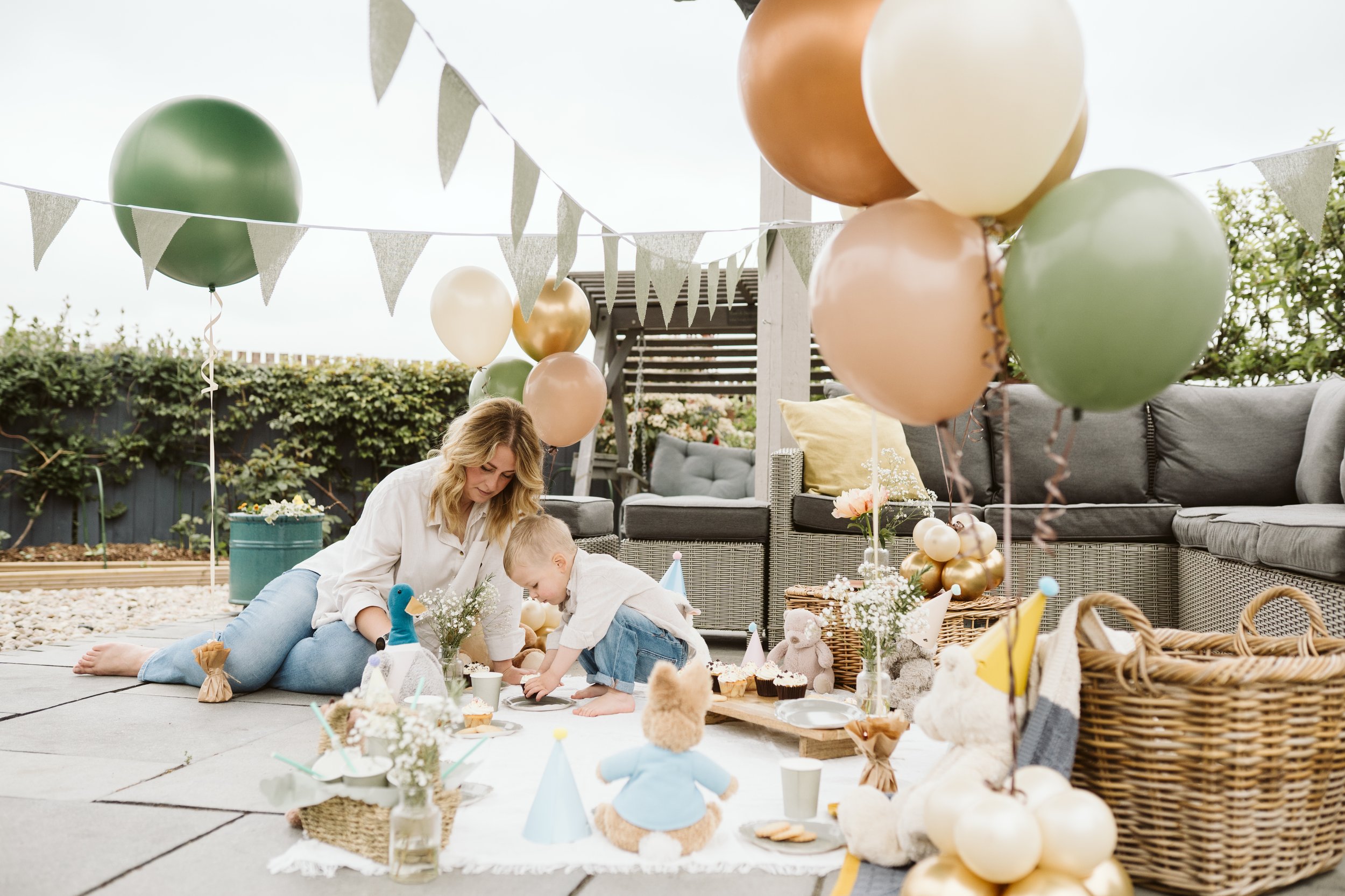 Child and mum enjoying a beautifully decorated outdoor party