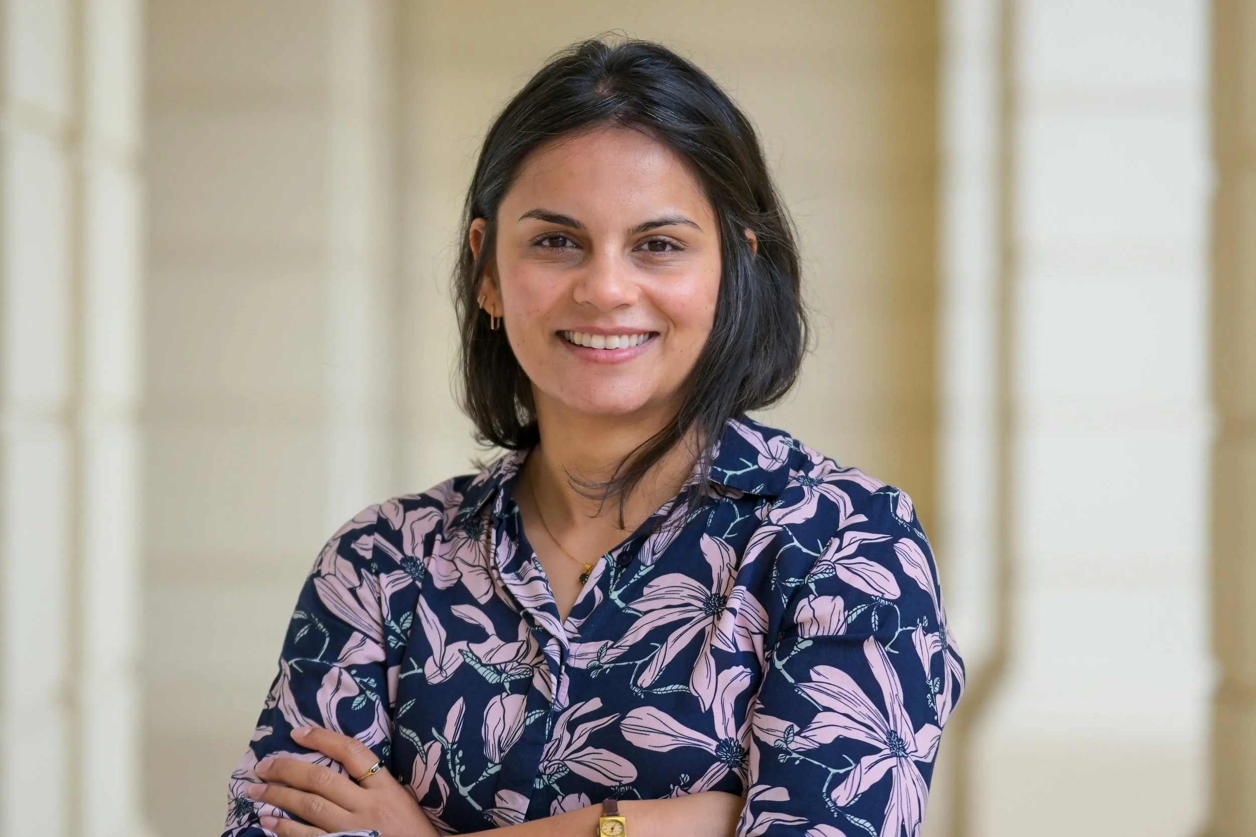 Professional headshot of a female co-founder of Antelope Health, Miranda Mathews, smiling with arms crossed.