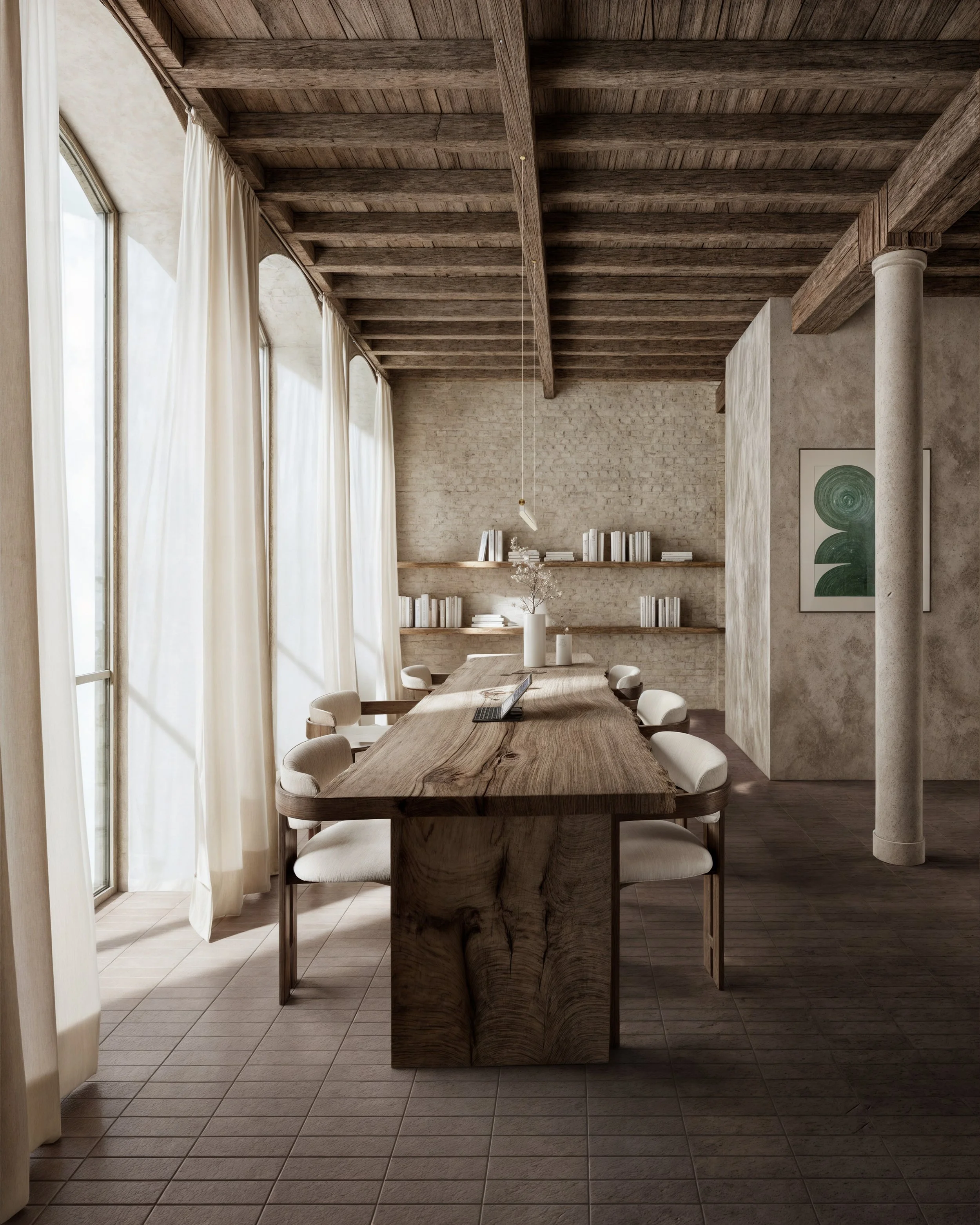 Modern dining room with wooden table and white chairs, large windows with white curtains, and shelves with books on textured beige walls.