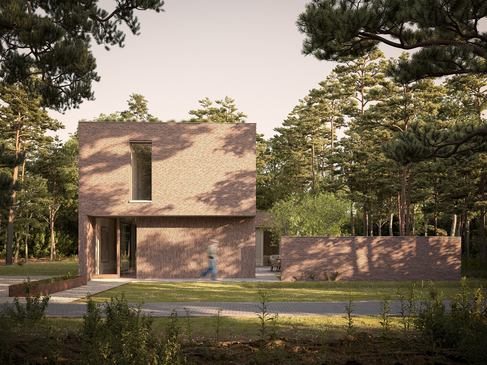 A modern brick house surrounded by trees, with a pathway leading to the entrance and a person walking past.