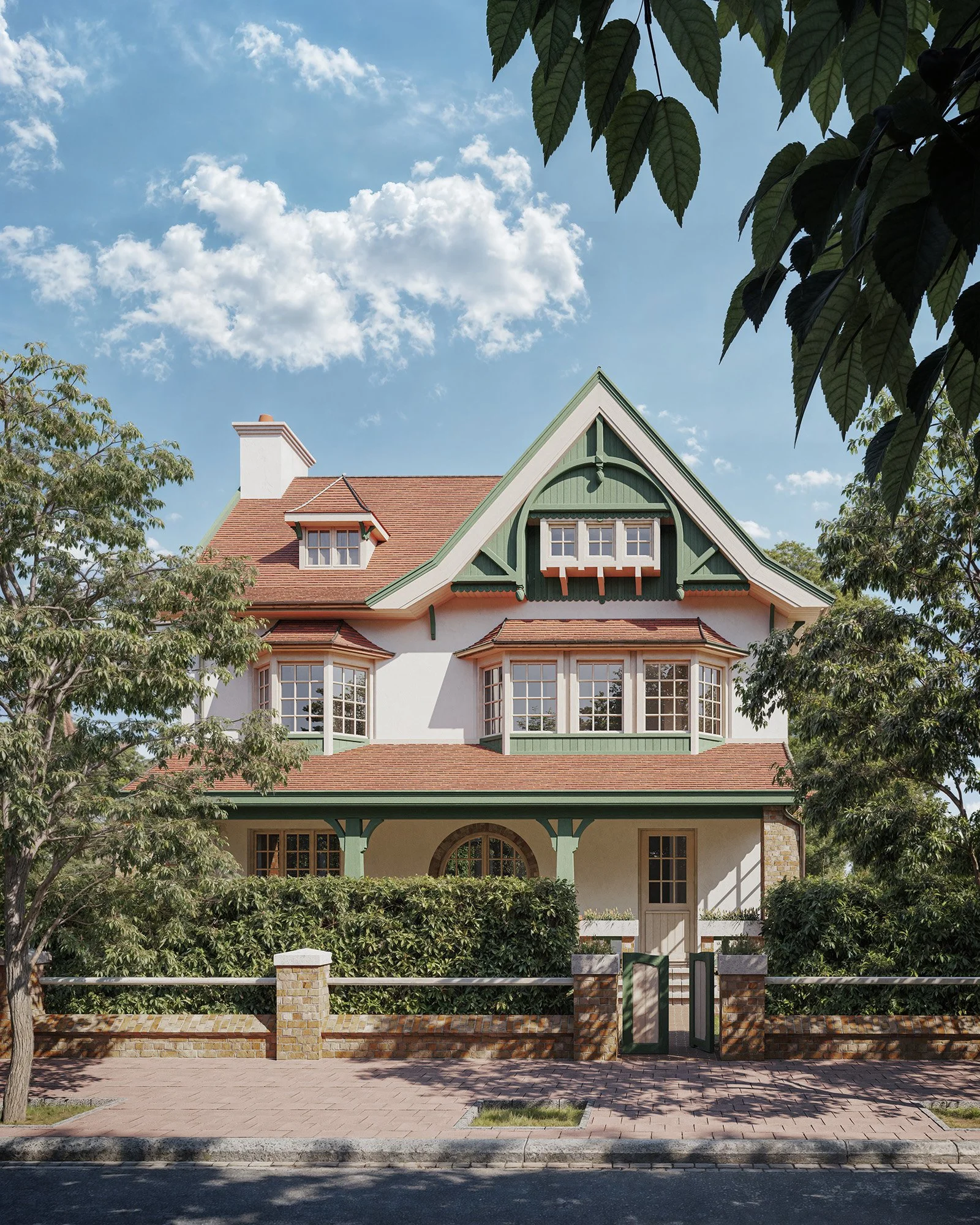 Front view of a large, Victorian-style house with green trim, white walls, and a brown shingle roof, partially obscured by trees, under a blue sky with clouds.