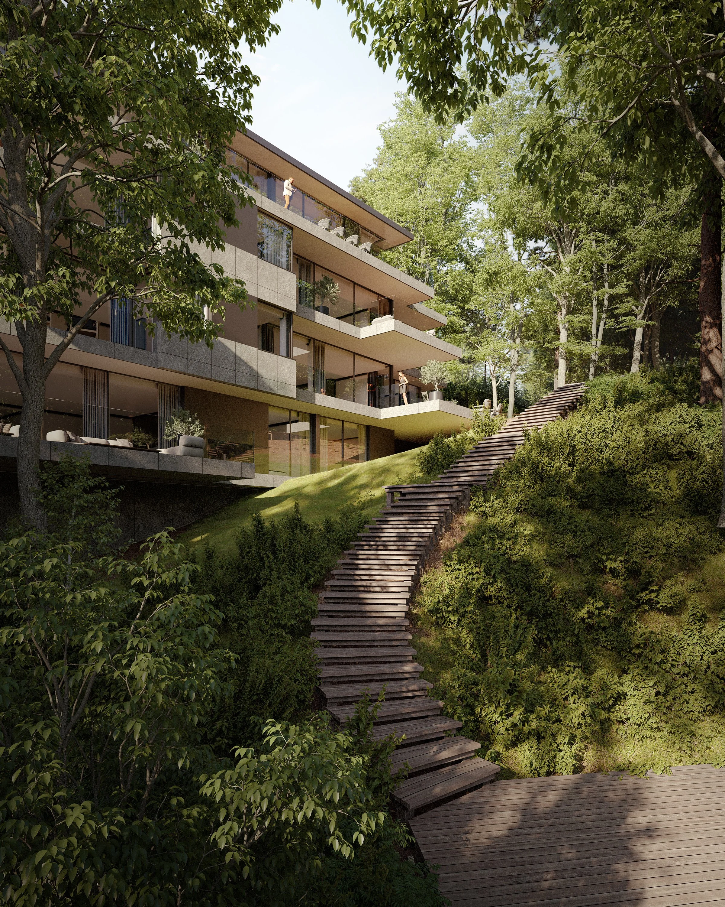 A modern multi-story apartment building with balconies, situated on a hillside surrounded by trees and greenery. There is a wooden staircase climbing the slope beside the building, leading up through the foliage.
