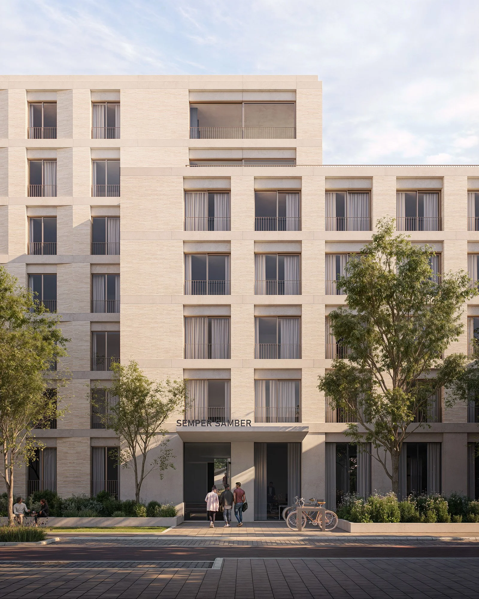 A modern multi-story residential building with large windows, balconies, and lush trees in front. The building has the words 'SEMPER SAMBER' near the entrance, with people walking and sitting outside, and bicycles parked nearby.