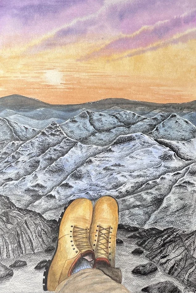 A person sitting at the edge of a mountain ledge with yellow hiking boots, overlooking snow-capped mountains at sunset.