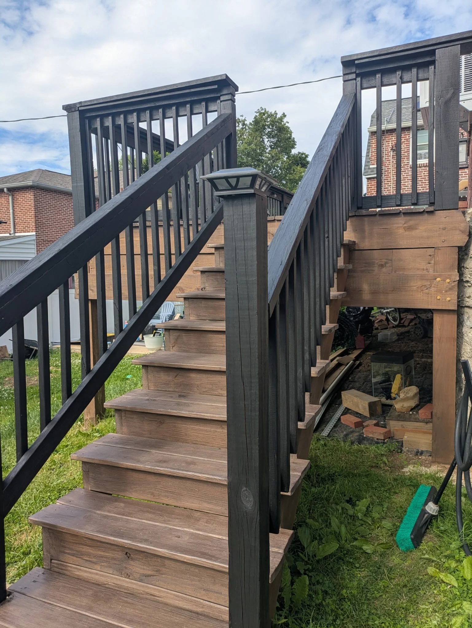 Deck stairs and railing brought to life with a fresh stain application. Delaware County PA