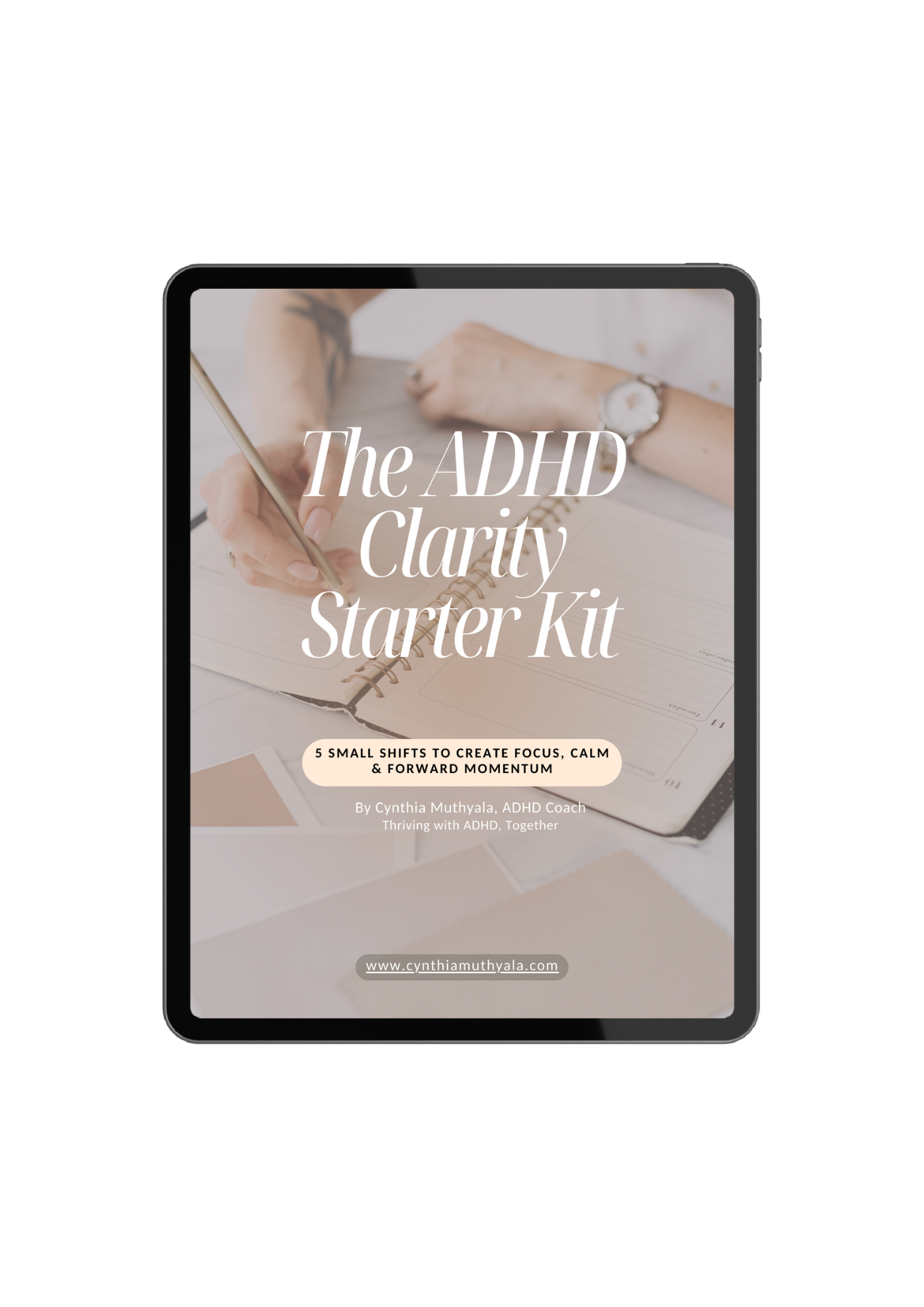 Digital device displaying the cover of a guide titled "The ADHD Clarity Starter Kit" with a blurred background of a person writing in a notebook.