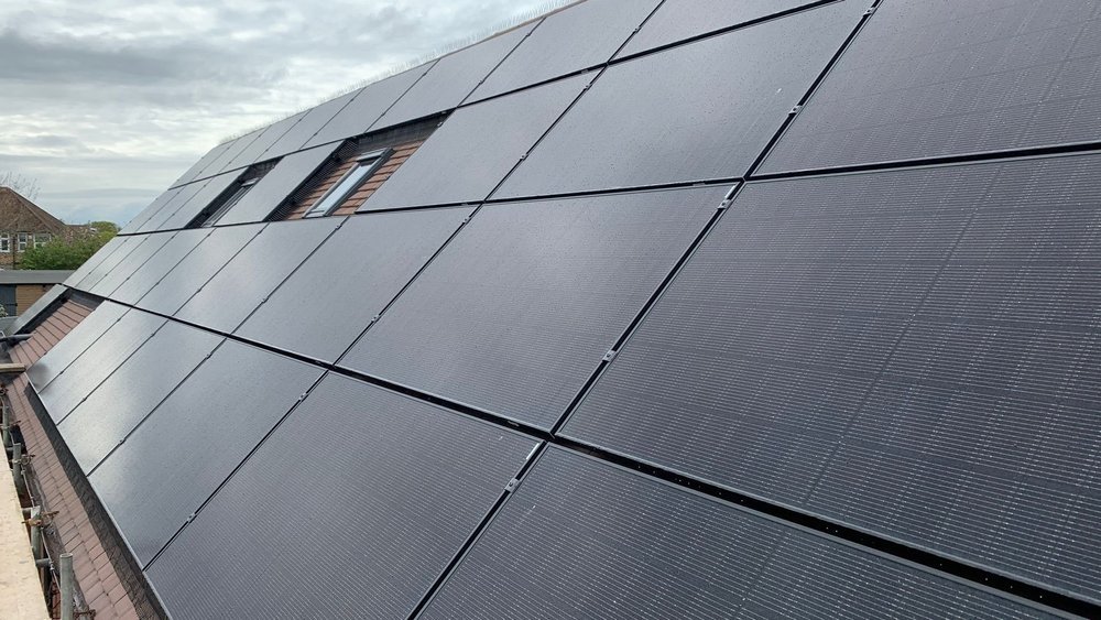 Photograph of solar panels installed on a house roof.