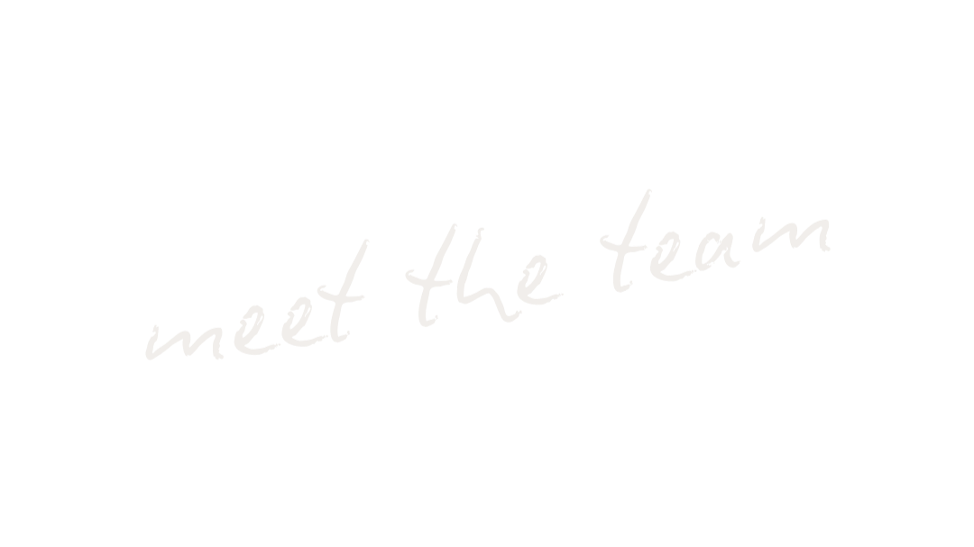 Black background with white handwritten text saying "meet the team".