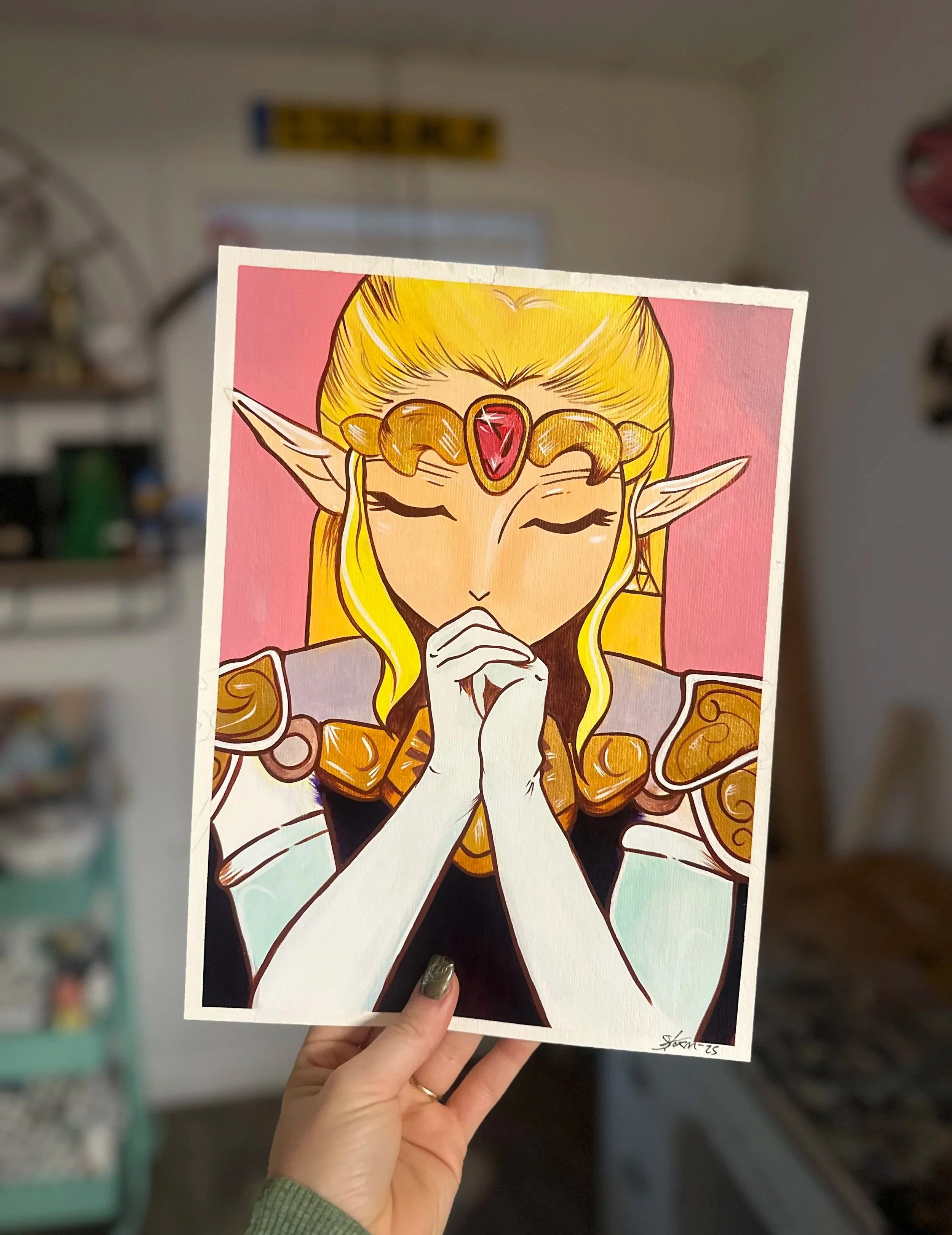 Artwork of a fantasy character, Princess Zelda with long blonde hair, elf ears, a jeweled headpiece, and closed eyes, holding hands near face in prayer or concentration.