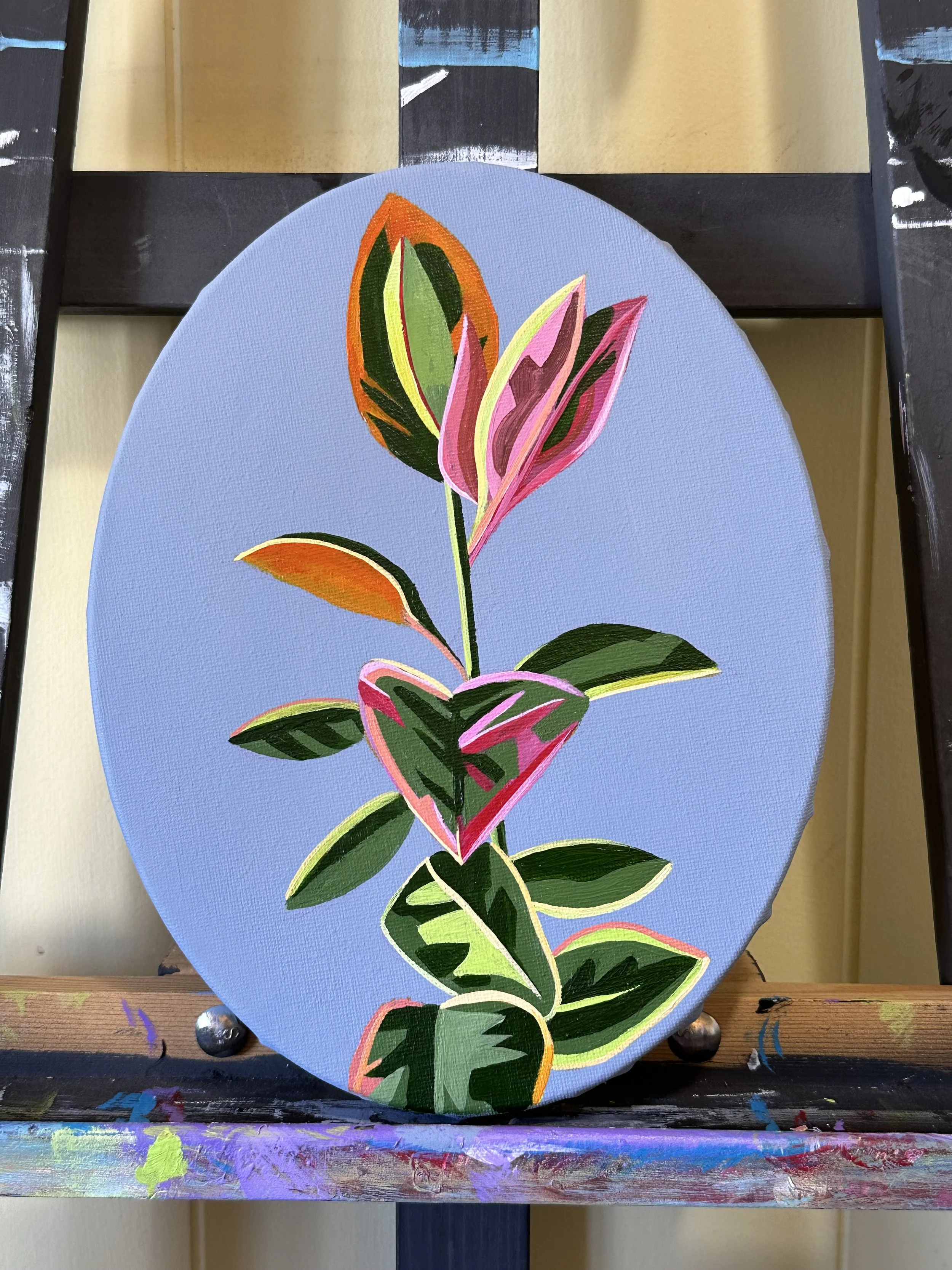 Colorful abstract painting of a plant with green leaves, pink and orange accents, on a light blue oval canvas.