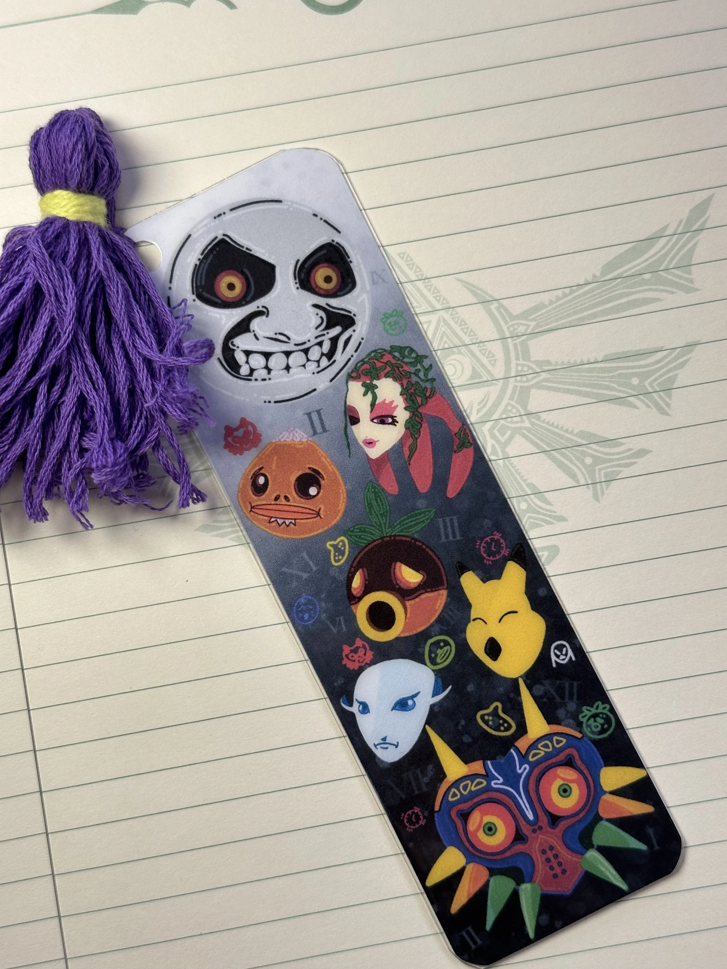 A striped bookmark featuring various characters from the game The Legend of Zelda: Majora's Mask, decorated with colorful stickers.