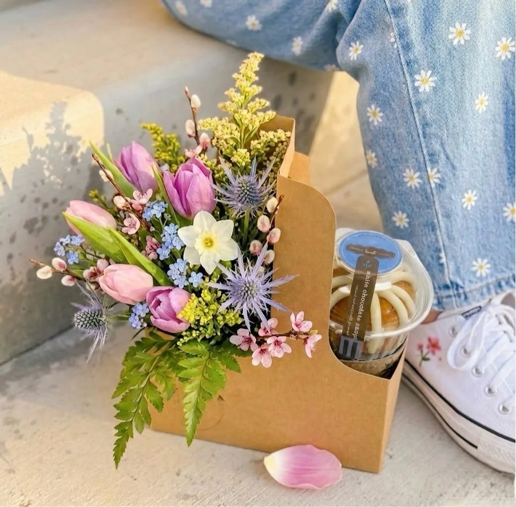 Meet the Carrie Cutie 💕
Half blooms, half treat&mdash;because balance. Choose your vibe with a drink, a gift card, or a sweet Nothing Bundt bundlet, all tucked into the cutest carrier. The perfect little pick-me-up (or drop-off 😉).

Mother&rsquo;s 