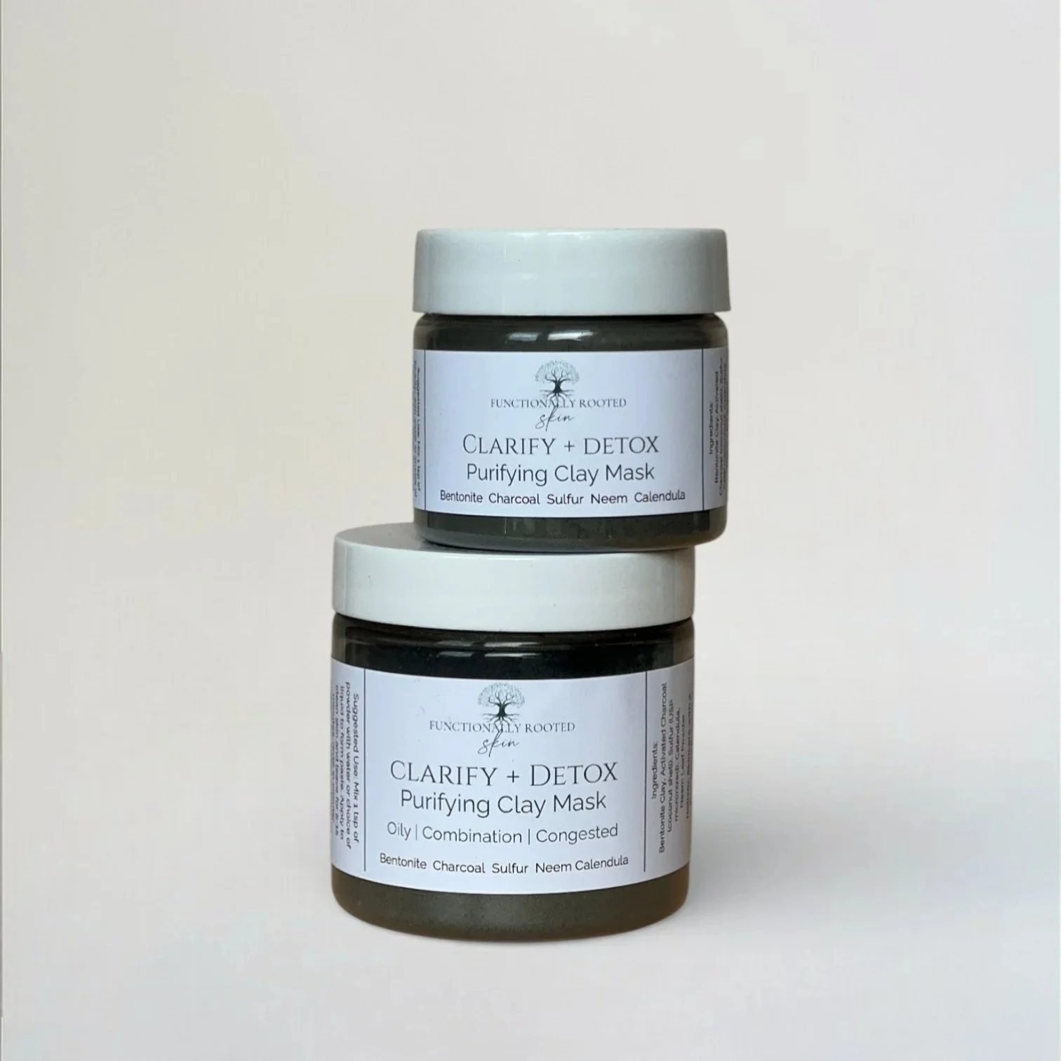 two jars of a powdered clay mask to help clarify acne prone skin
