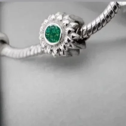 The Silver Sunflower Charm