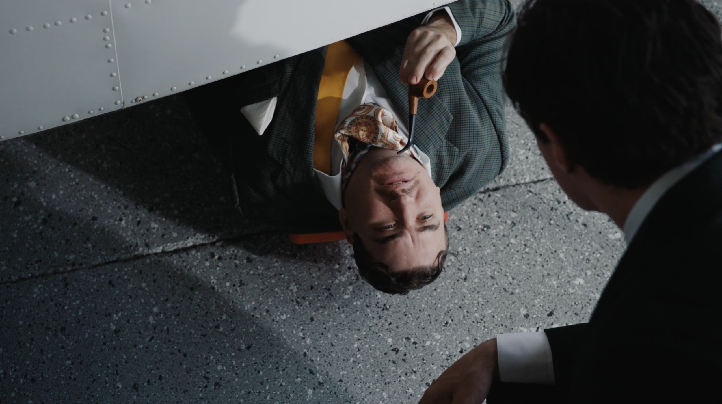 CLIVE´S JET

In a private hangar, a sleek self-important salesman and an aristocratic buyer circle around a luxury jet, competing ego for ego during an attempted sale. 