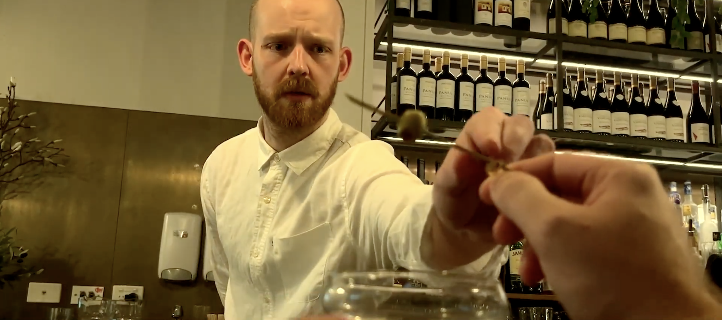 THREE OLIVES

"Three Olives" is a darkly comic short set in an elegant bar where silence and social anxiety rule. It follows a painfully conflict-averse bartender and a fragile customer whose simple request for a dry martini with three olives spirals