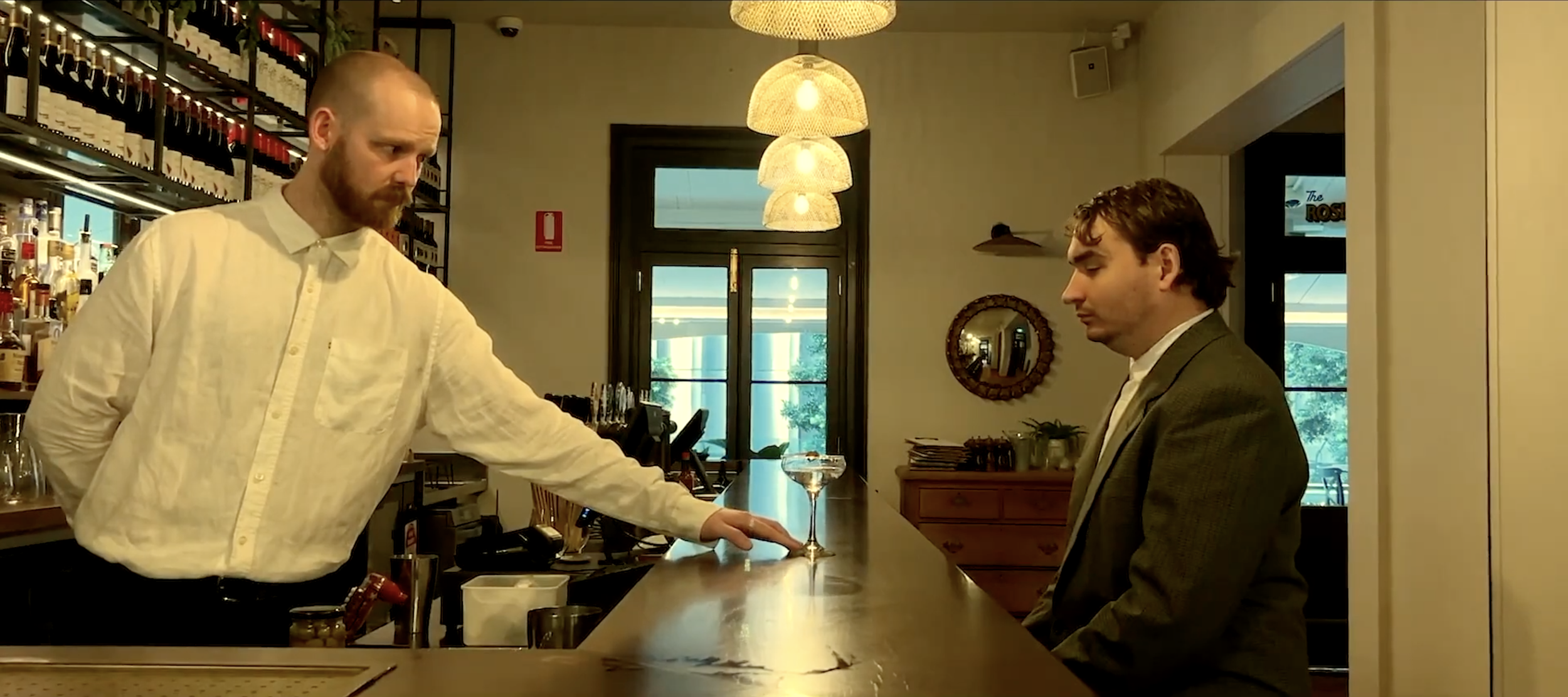 THREE OLIVES

"Three Olives" is a darkly comic short set in an elegant bar where silence and social anxiety rule. It follows a painfully conflict-averse bartender and a fragile customer whose simple request for a dry martini with three olives spirals