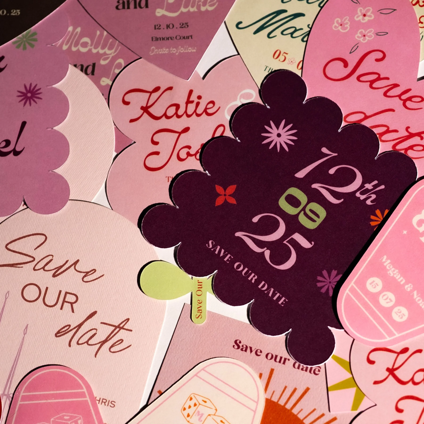 A collage of colorful paper save-the-date cards for a wedding, featuring floral and decorative designs, with text indicating the date of the event, October 25, 2023, and names Katie and Joe.