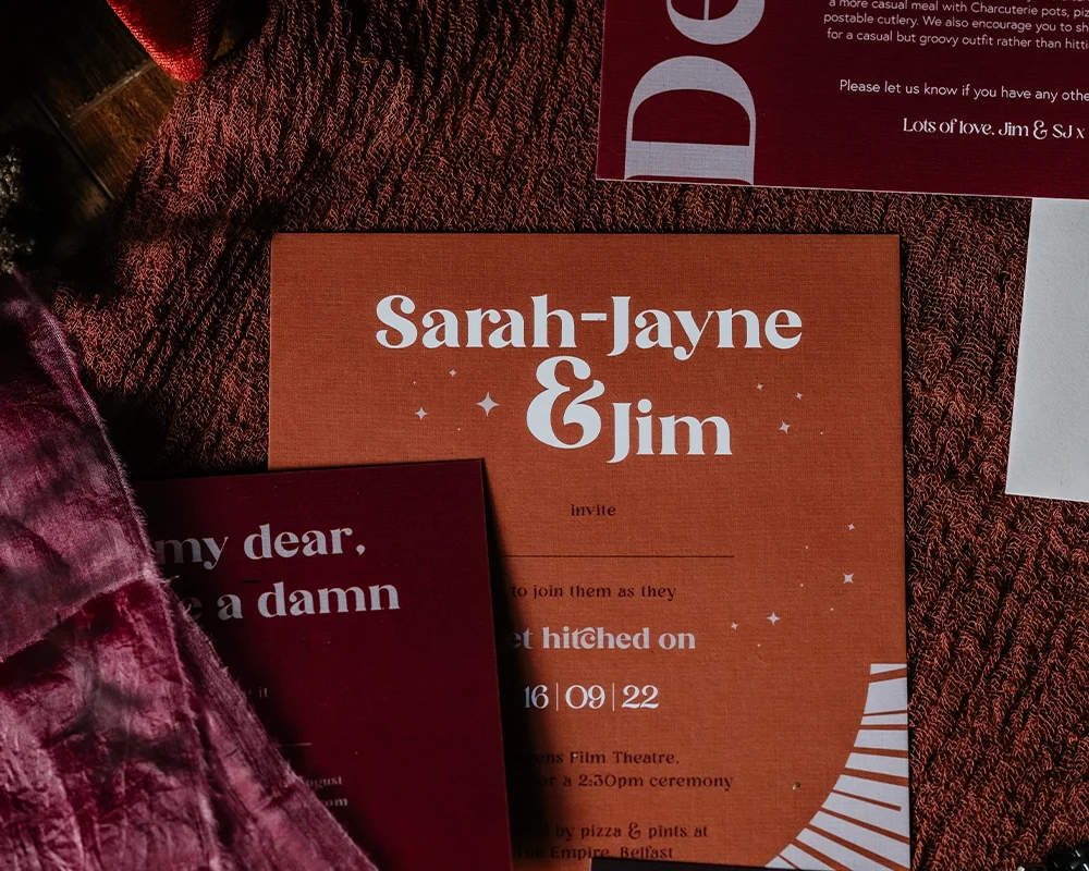 Wedding invitation for Sarah-Jayne and Jim with event details and date.
