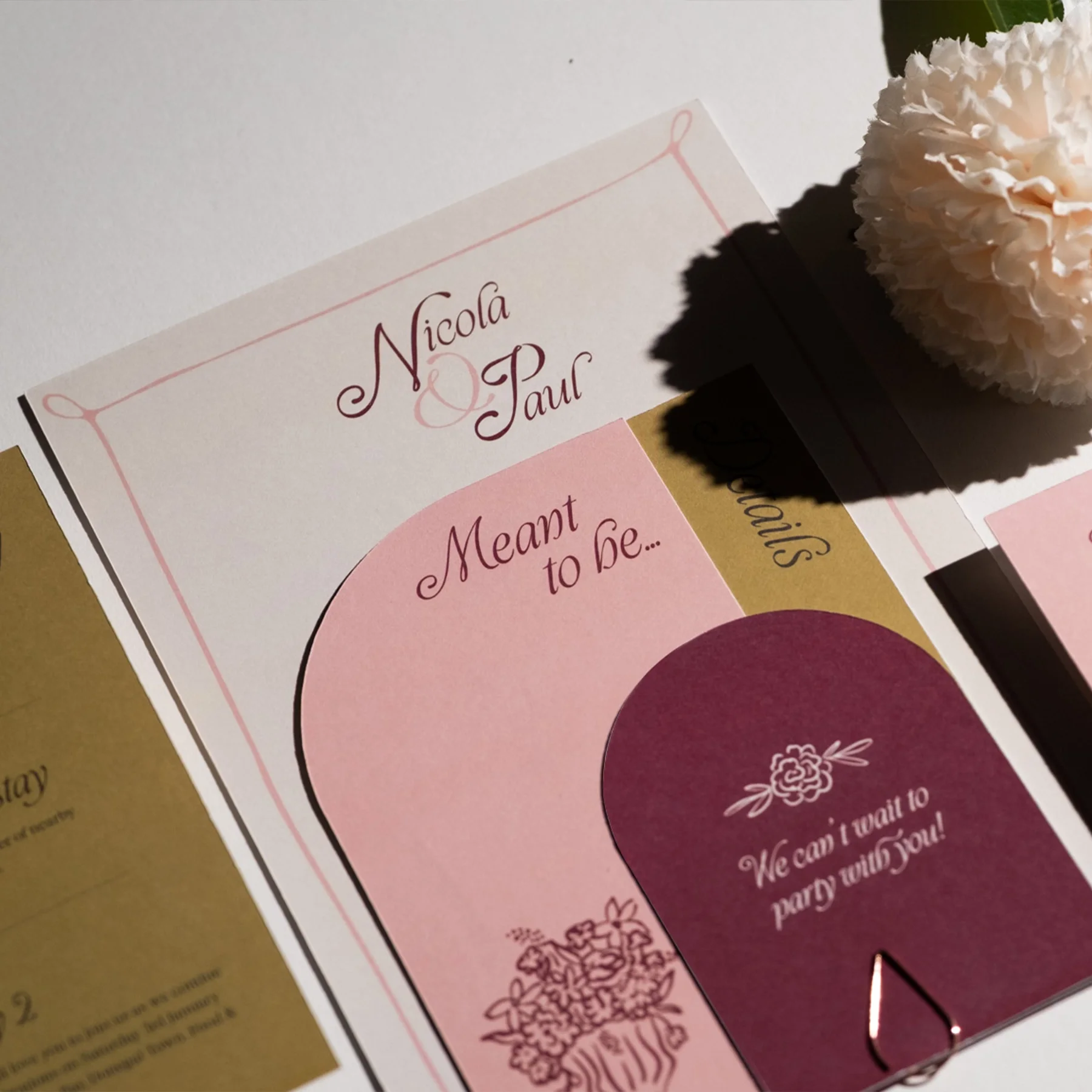 Wedding invitation or card with the names Nicola & Paul, pink and cream colors, floral design, and the message 'We can't wait to marry with you!'